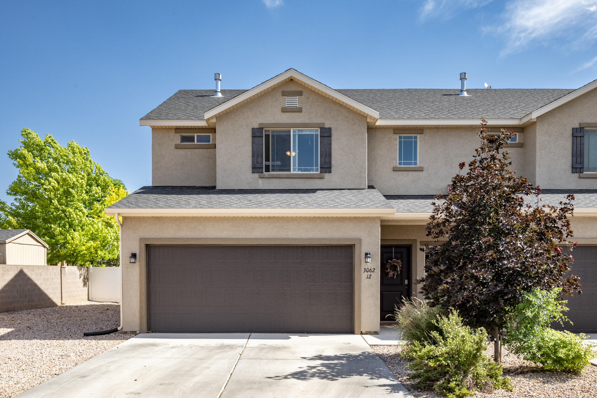 Beautifully maintained and tastefully decorated 3 bedroom, 2.5 bath townhome in desirable Sycamore Trail! This spacious floor plan offers comfortable living with plenty of natural light and room to relax with a cozy gas fireplace to complete the space. The well-appointed kitchen flows nicely into the living and dining areas, making it perfect for everyday living or entertaining. Enjoy the convenience of a 2-car garage along with a large fully fenced and landscaped corner unit yard with mature trees creating a private outdoor space to unwind. Immaculately cared for and move-in ready, this home truly checks all the boxes. Whether you're searching for your first home, a vacation getaway, or a great investment opportunity, this is the complete package!