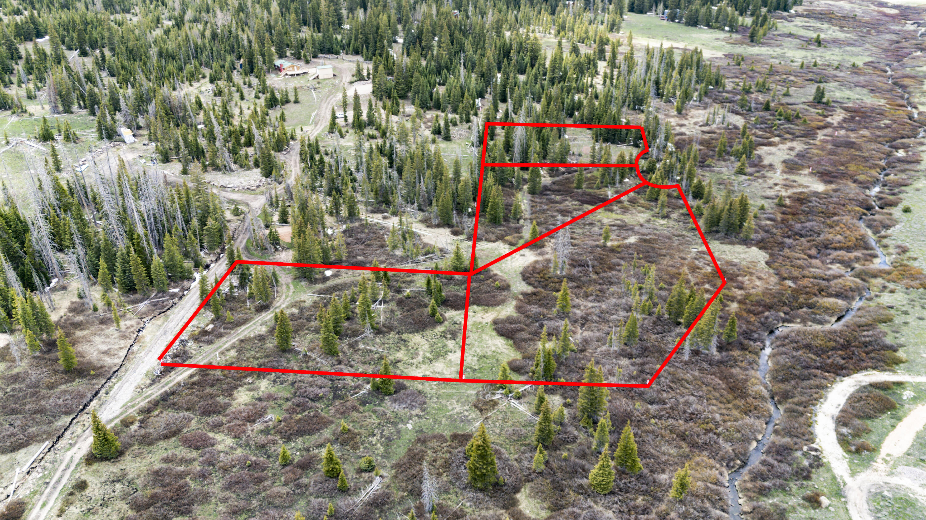 Extraordinary opportunity to own this rare 3.48 acres of mountain property tucked away in the pine and aspen trees with mammoth creek that runs along the north side of the property. Four individual adjacent lots in total, lots 24, 51, 52 & 53 make this a great option for a family getaway to camp, recreate, or build that mountain cabin you always dreamed of. Just minutes from Brian Head Ski Resort, Panguitch Lake, Navajo Lake, Cedar Breaks National Monument, and so much more! Off grid style living but water is available & can be hauled from the fill station. Seasonal access by vehicle in the summer and by snowmobile in the winter months. Escape the summer heat and city lights in exchange for cool fresh mountain air and star gazing nights.