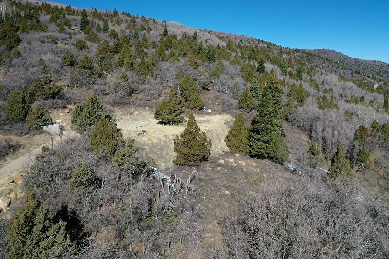5-acre lot in the 3200 Subdivision, ideally located just minutes from Brian Head, Cedar Breaks, and I-15. This property is ready to build with a prepared building pad, installed septic system, and water tank already in place. Surrounded by Aspen and Pine trees, the lot offers a private setting with natural beauty. The subdivision provides access to a water fill station, with power typically provided by solar and propane delivery available in the area. A rare opportunity to own a build-ready mountain property with essential improvements already completed.