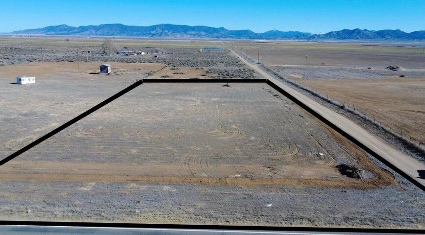 Rare opportunity to own 1.31 acres near Beryl Junction with paved Highway 18 access and 1 AF of valuable water right (#71-3536). Recently cleared and ready to use. This property includes a shared well agreement with the parcel to the North, which has recently installed a brand-new well for connection. A septic tank is already in place, with power nearby approximately 75 feet to the Northeast. Ideal for a primary residence, second home, cabin, or private family retreat. Enjoy wide open views, dark skies, and rural freedom with quick access to town. Located just 10 minutes from Enterprise for gas, groceries, schools, and medical services, and under an hour to Cedar City and St. George. A versatile property with infrastructure, water, and accessibility already in place. come take a look.