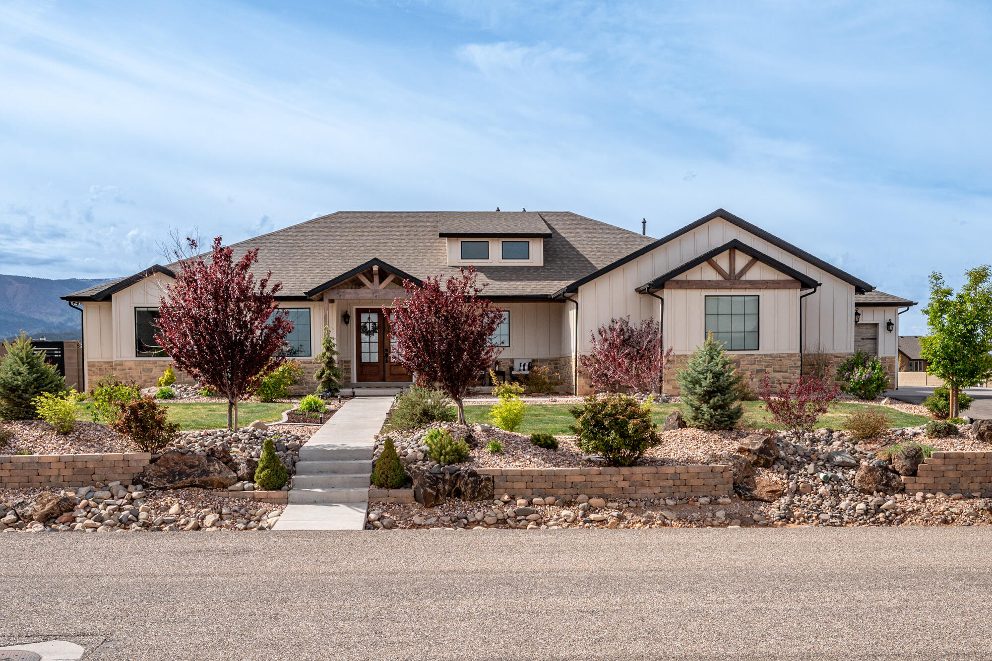 Stunning open-concept home on over an acre in 4B Ranches with breathtaking views of Shirtz Canyon! The incredible great room features open beams, built-in cabinetry, and a show-stopping fireplace. High-end finishes throughout, including a gourmet kitchen with quartz & natural stone countertops, a huge island & a spacious butler's pantry. Luxurious main-level primary suite with direct access to the laundry room. Huge sunny office with built in bookcases. Fully finished basement offers a second laundry room and 3 additional bedrooms. Oversized garage with a third bay for all your toys. Side RV parking with hookups, block wall fencing, and a professionally landscaped yard complete with a pickleball court. A rare find!