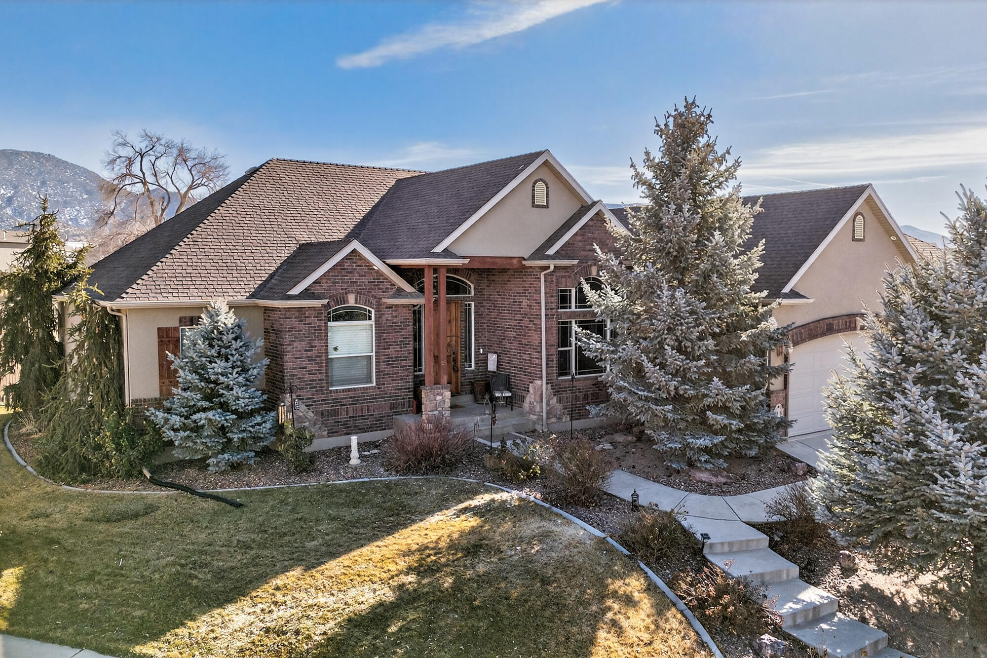 Spacious and thoughtfully designed, this 6 bedroom, 3 bathroom home offers approximately 4,275 sq. ft. of comfortable living space in the Old Farm subdivision, located at the end of a quiet cul-de-sac. Architectural details, multiple fireplaces, and generous living areas create a warm and functional layout. The kitchen features granite countertops, double ovens, a pantry, and ample workspace for everyday use or gatherings. Extensive garage and workshop space includes multiple attached and detached garages, offering flexibility for vehicles, storage, or projects, along with RV parking. The landscaped yard provides multiple outdoor seating areas and mature trees, creating a peaceful setting to enjoy the surroundings.