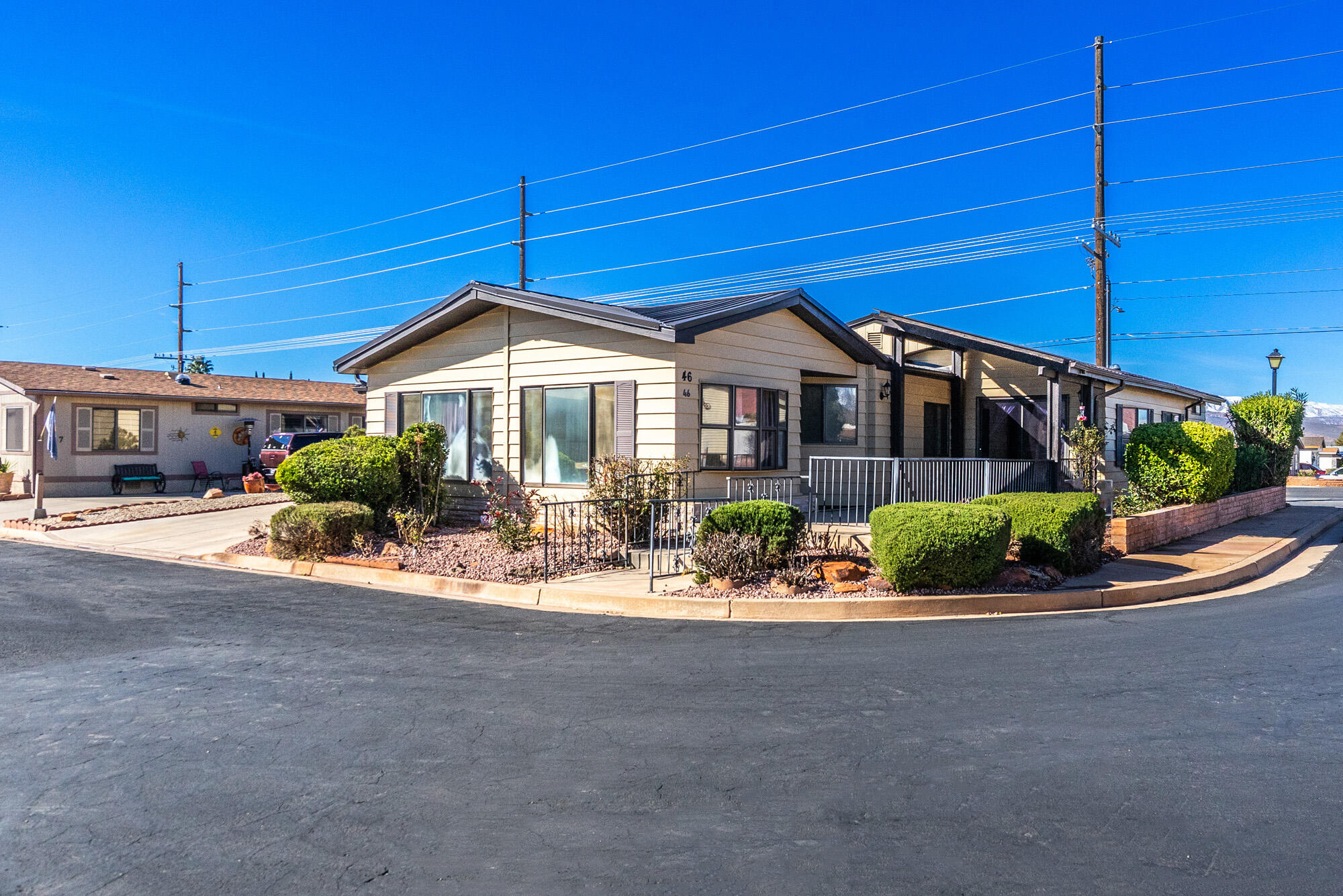 This sought after 55+ Community - Rainbow Ridge.  
Home is 2 Bedrooms, 2 Full Baths, Spacious Kitchen w/double ovens, newer refrigerator, Family Room w/Built in wet bar and built in hutch. Primary Bedroom has on-suite bathroom with walk-in closet, as well as an additional room that is perfect for an office or craft room! Separate Laundry Room, plus an enclosed sun porch. Also an attached 2- Car Garage! 
*Recent updates include: New Hard Flooring, Water Pipes underneath certain parts of the home, Metal Roof, Furnace, Water Heater and Garage Door! 
Seller is offering a $10,000 concession towards updates, or to 'buy-down interest rates, or whatever buyer would like to use it toward.  Don't miss this very special property. As you can tell it has been very well taken care of. It is conveniently located in the community and is near the entrance of the park and across from the clubhouse where there is ample parking for your guests!!