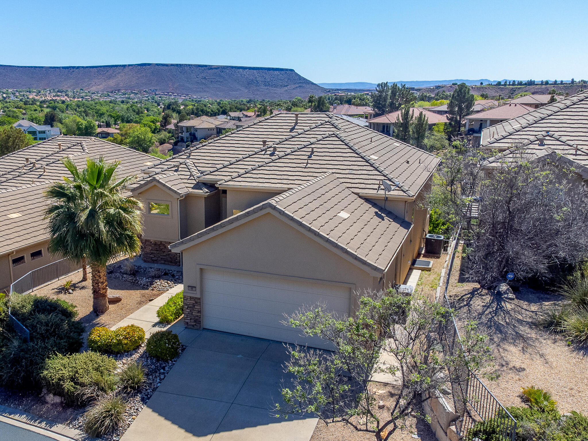Located just above the signature Woodbridge fairway at Sunbrook Golf Course, this home offers the kind of easy, elevated living that's highly desired and hard to find. Thoughtfully designed with abundant windows and light, tall ceilings, covered porches and patios, an open floor plan, with all highlighting views and scenery outside. Inside, the home keeps main-level living in mind with both a beautiful primary suite and a second bedroom that works perfectly as a guest room or office. You'll also love the laundry/project room on the main level, which has space for projects, crafts, sewing - whatever you need! Enjoy an oversized deck just off the great room--it's truly an extension of your living space and the perfect spot to relax or entertain year-round. Downstairs, the open space continues to impress with 9' ceilings, 8' doors, and large windows that bring in incredible natural light. A comfortable second living area as well as two great en-suite bedrooms, plus a versatile bonus room--ideal for a gym, theatre, craft space, or whatever fits your lifestyle.  The walk-out lower level leads to a beautifully usable yard, offering ample space to enjoy outdoor fun or relaxation. And if that's not enough - this area in Sunbrook offer full and access to a private clubhouse w/two pools, spa, gym, pickleball courts, and an events center.  Come see for yourself - this is one of those homes that has it all and just lives right.
