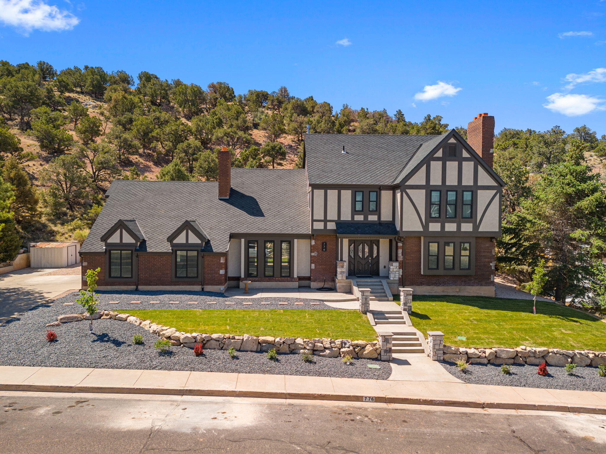 Wonderful one of a kind Tudor in Fiddlers Canyon! This is a perfect family home offering 5 nice sized bedrooms, and 2.5 baths, with a 2 car garage that has a shop area with heat and power! The homes exterior was updated in 2024, and looks absolutely pristine including a 50 year roof, and heavy duty double hung windows. The kitchen and upstairs baths were just updated in 2026 making this 
home move in ready! A gorgeous gas fireplace in the living room, and wood burning fireplace in the main floor family room make all your gatherings feel warm and inviting. French doors lead out to the covered patio and secluded backyard covered with natural trees. Brand new beautiful landscaping make the yard feel fresh and inviting. Large 2nd family room in the basement has built in storage, and a Dolby Atmos Home Theater System with 9 built in speakers and projector w/ 120'' screen. To many upgrades to list, please see upgrades list in docs tab. Don't miss out on this amazing home! Come take a look today!