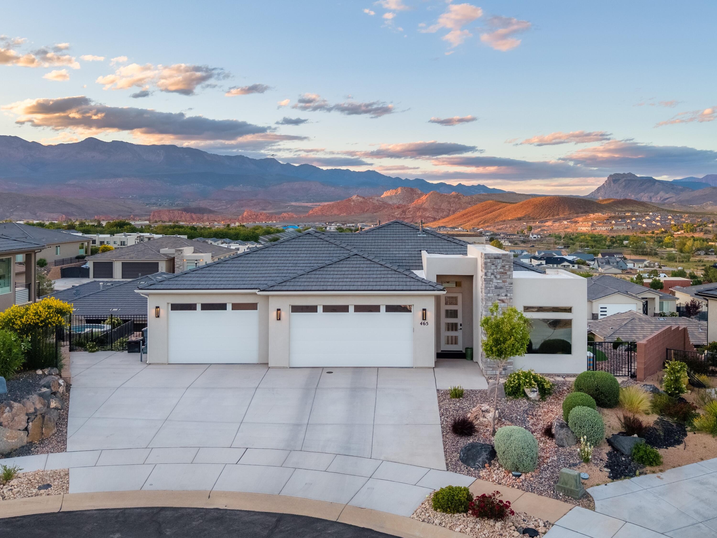With unobstructed, 180-degree views, the pictures will never truly capture the experience you'll have by seeing this home in person. Come see this spacious 3,254 square-foot, 4-Bedroom (plus flex room) Retreat with unrivaled views. When it's yours, you'll have the unique experience of waking up to the majesty of the American Southwest. Nestled in the premier Zion Vista community, this spacious home was custom designed to showcase unobstructed panoramas of Zion National Park, Kolob, Pine Valley Mountain and the Hurricane Valley below.

Key Features:
- Versatile Layout: Featuring effortless main-level living and a full walk-out basement with oversized large guest rooms, a second kitchen, and its own laundry and entrance--perfect for multi-generational families. 

- Dedicated Workspace/Flex Room: The heated 3-car garage includes a third bay expertly converted into a private, climate-controlled space. With its own mini-split and separating wall, it's a ready-made workshop, home gym, or hobby studio.

- Indoor-Outdoor Harmony: Enjoy the horizon from the expansive covered deck or the private backyard, complete with a hot tub and gas fire pit for watching the valley lights sparkle at night.

- Community Perks: Low $44/month HOA includes access to a putting green, pickleball courts, and a pavilion.

This is more than a home; it's a front-row seat to Southern Utah's natural wonders.