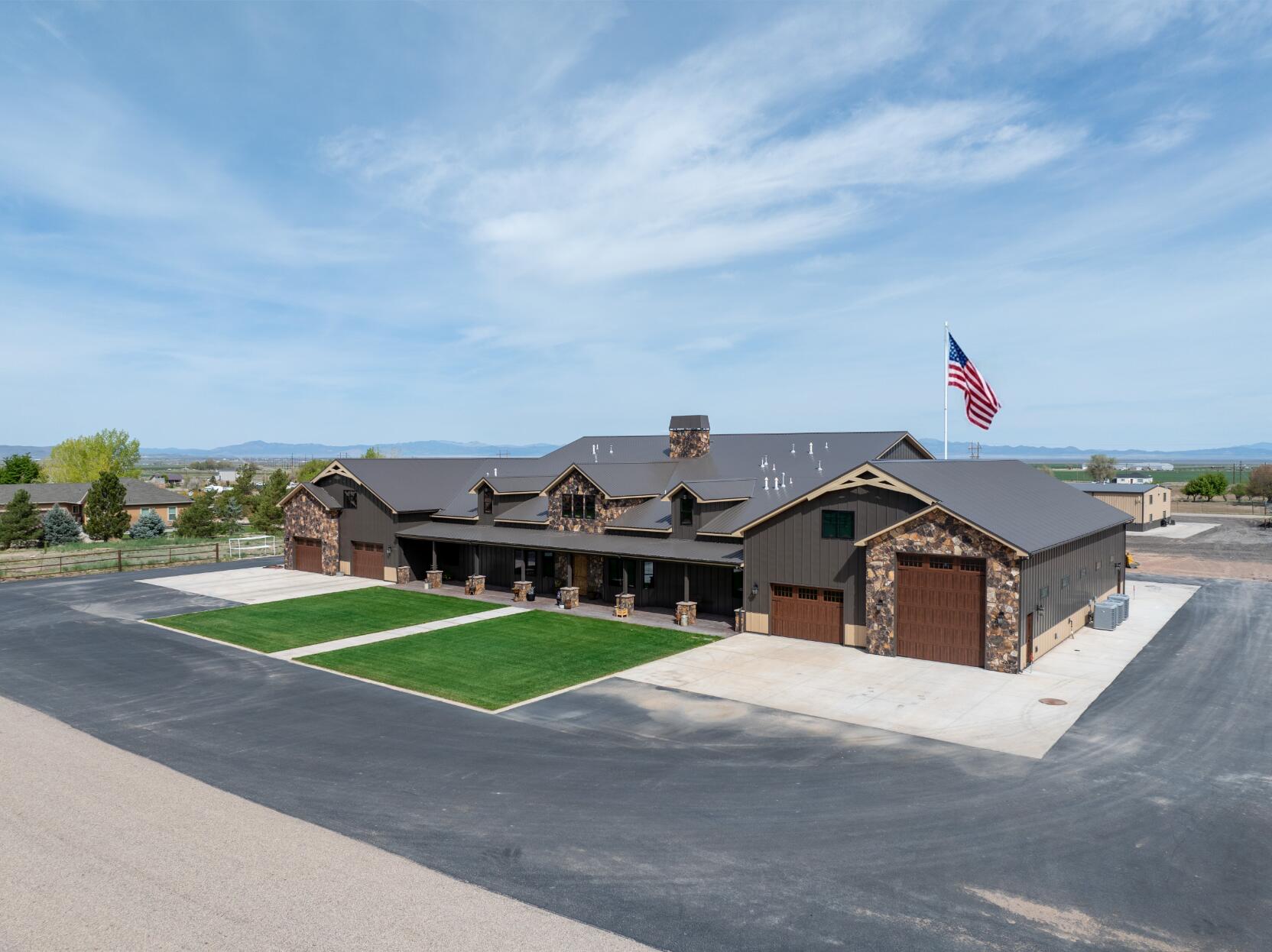 If you've been waiting for something with real space, this is it! Set on just over five acres in Broken Spur, this newly built estate (2024) offers nearly 10,000 square feet of living space designed for those who need room for everything--and then some. The main residence is expansive and well-appointed, complemented by a separate 3-bedroom, 3-bath apartment within a dedicated workshop structure, offering flexibility for guests, extended living, or on-site support. A spacious bunkroom adds even more versatility. For those who need serious garage and storage capacity, the property delivers in a way few can. A 16-car garage with a pull-through RV bay is paired with a 4-bay workshop, creating space for collections, equipment, or business use without compromise. The grounds are equally functional, featuring a corral and small barn, making the property well-suited for animals or a variety of rural lifestyle uses. Properties of this scale, with this level of infrastructure and flexibility, are rarely available. It's the kind of place that doesn't ask you to scale back your lifestyle--it gives you the space to fully live it.