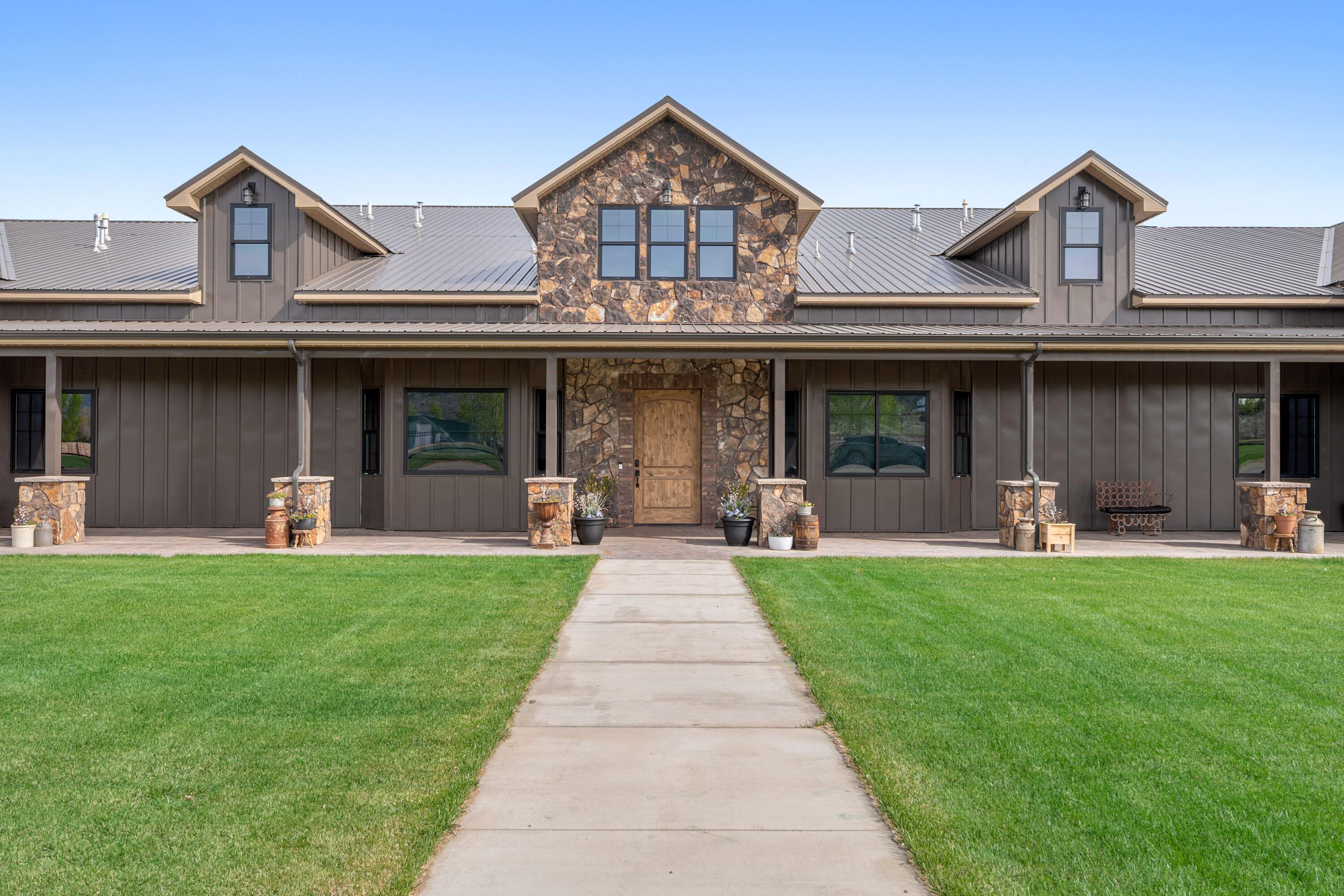 If you've been waiting for something with real space, this is it! Set on just over five acres in Broken Spur, this newly built estate (2024) offers nearly 10,000 square feet of living space designed for those who need room for everything--and then some. The main residence is expansive and well-appointed, complemented by a separate 3-bedroom, 3-bath apartment within a dedicated workshop structure, offering flexibility for guests, extended living, or on-site support. A spacious bunkroom adds even more versatility. For those who need serious garage and storage capacity, the property delivers in a way few can. A 16-car garage with a pull-through RV bay is paired with a 4-bay workshop, creating space for collections, equipment, or business use without compromise. The grounds are equally functional, featuring a corral and small barn, making the property well-suited for animals or a variety of rural lifestyle uses. Properties of this scale, with this level of infrastructure and flexibility, are rarely available. It's the kind of place that doesn't ask you to scale back your lifestyle--it gives you the space to fully live it.