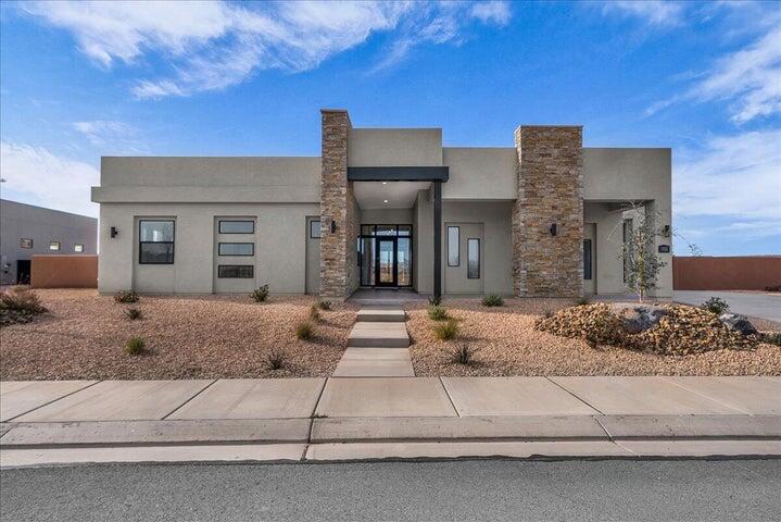 Discover luxury desert living in the prestigious Estates at Sand Hollow. Located at 3322 Guide Star Way, this move-in-ready Aspen plan from Carefree Homes' Luxe Collection offers an exceptional combination of quality craftsmanship, modern design, and resort-style amenities.

Featuring 2,619 square feet, 4 bedrooms, and 3.5 bathrooms, this thoughtfully designed home boasts an open-concept floor plan that seamlessly blends comfort and functionality. The gourmet kitchen flows effortlessly into the spacious great room, while retractable floor-to-ceiling glass patio doors create a true indoor-outdoor living experience, perfect for enjoying Southern Utah's year-round sunshine.

The luxurious primary suite provides a private retreat, complemented by premium finishes throughout including 10-foot ceilings, 8-foot doors, upgraded luxury vinyl plank flooring, and pre-wiring for four zones of surround sound. Built with energy-efficient 2x6 construction, this home delivers both quality and lasting value.

A standout feature is the oversized 40-foot RV garage complete with epoxy floors and Carefree Homes' signature built-in shelving, offering ample space for recreational vehicles, toys, and storage. The professionally completed 360-degree low-maintenance landscaping and included window coverings make this home truly turnkey.

Enjoy the unparalleled lifestyle of Sand Hollow with HOA amenities that include access to resort facilities, discounted golf rates, and exclusive community events. For those seeking the ultimate backyard oasis, the builder can add a custom pool at closing for approximately $150,000, with completion anticipated within 90 days after closing. Contact the listing agent for details and available pool options.