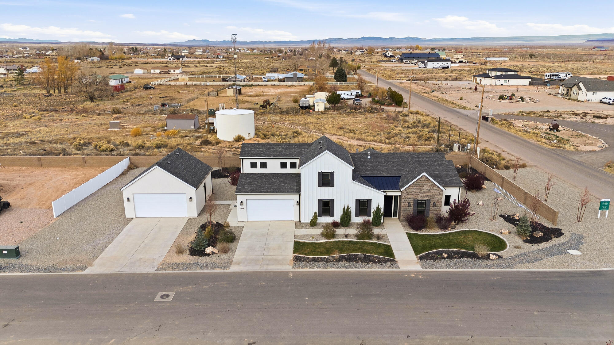 This beautiful brand-new home in the highly sought-after Painted Desert Subdivision offers modern farmhouse charm with thoughtful design throughout. Sitting on a .40-acre corner lot, the property is fully landscaped & move-in ready. With 5 bedrooms, 3.5 bathrooms, and 2,820 sq ft, this home offers a spacious, open floor plan perfect for everyday living & entertaining. The inviting living room features floor-to-almost-ceiling sliding doors, flooding the space with natural light & providing a beautiful view of the covered patio and backyard. A cozy fireplace with built-in shelves & cabinets adds warmth & function. The kitchen has modern finishes, a large walk-in pantry, & an easy flow into the dining and family areas. An office/den is conveniently located off the entryway, providing a quiet workspace or flex room. Upstairs, you'll find a second family room above the garage - complete with its own bathroom - making it ideal for guests, recreation, or a media room. The primary suite offers a relaxing retreat with a spacious walk-in closet, dual sinks, and a large walk-in shower. Parking and storage are abundant with a deep 3-car attached garage plus a 2-car detached garage, perfect for vehicles, toys, or a workshop. Located just minutes from Cedar City and convenient to shopping, dining, and outdoor recreation. New, never occupied - a rare opportunity in one of the area's premier new communities!

**Use of the preferred lender, Dewey Warner with Intercap Lending, qualifies the buyer for a 1% contribution toward seller-paid closing costs or an interest rate buy-down.**