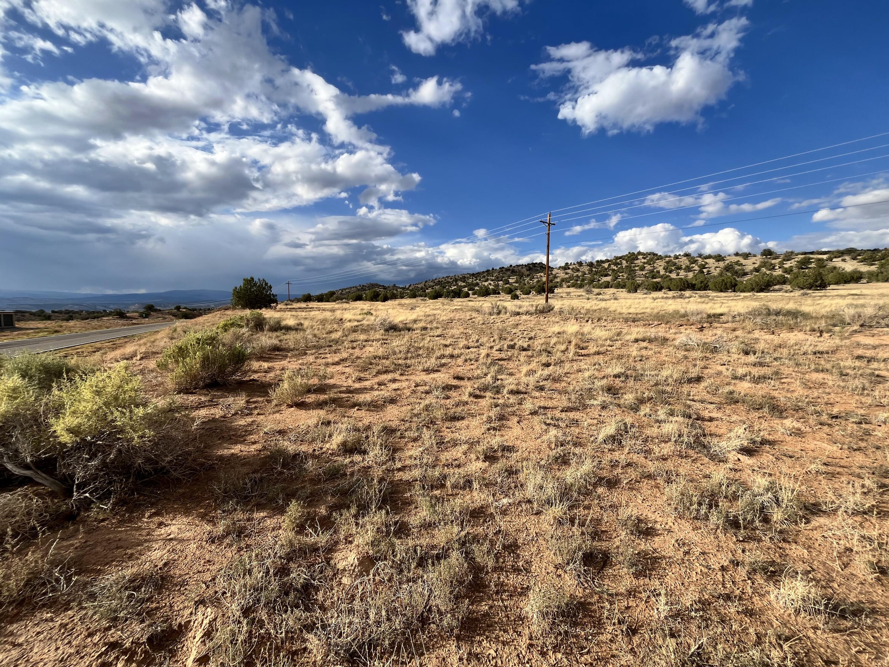 This versatile 2.77 acre property sits just outside the east boundaries of Escalante. Power poles run through the property (would need to verify whether connection was possible) You may envision a commercial venture along the Highway 12 frontage or a private home tucked back in the trees- both with sweeping views of the Escalante Valley. Water rights would need to be acquired for a well. Located just 23 minutes from Calf Creek and 20 minutes from Zebra Slot Canyon Trailhead, the property is close proximity to some of the most sought-after landscapes for outdoor recreation.