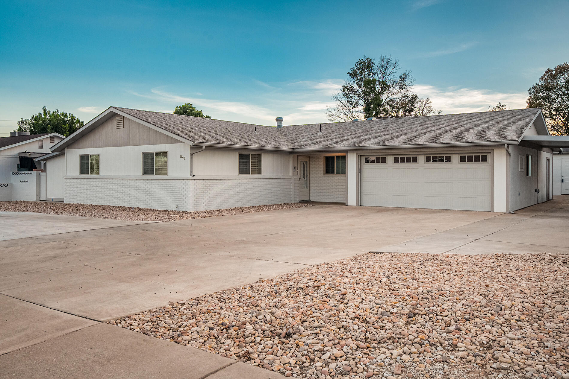 Classic St. George charm meets modern updates in this beautifully refreshed 4-bedroom + den, 2.5-bath home, ideally located just minutes from the university, hospital, shopping, and everyday conveniences. Inside, you'll find fresh paint, new carpet, a spacious kitchen with a large island, new Bosch appliances (refrigerator included), and convenient roll-out wire shelving. The remodeled primary suite features a stunning primary bathroom, and two large walk-in closets. Bedroom 4 and the den each offer private exterior entrances, creating flexible space for guests or a home office. Thoughtful upgrades continue throughout with plantation shutters, a skylight that brightens the kitchen and dining area, double-pane windows (new in 2005), and a private pet entrance. The finished garage is climate-controlled with central air and includes epoxy flooring, a new oversized 17' garage door with 100,000-cycle springs, and a smartphone garage door opener. Outside, enjoy a fully fenced yard, circular driveway, abundant parking, two-car garage, carport, RV parking, automatic sprinklers (in back), drip irrigation (in front) for future trees or shrubs, and a detached workshop complete with power and lighting. Exceptionally well-insulated, this home offers comfort, efficiency, and timeless appeal in one of St. George's most convenient locations.