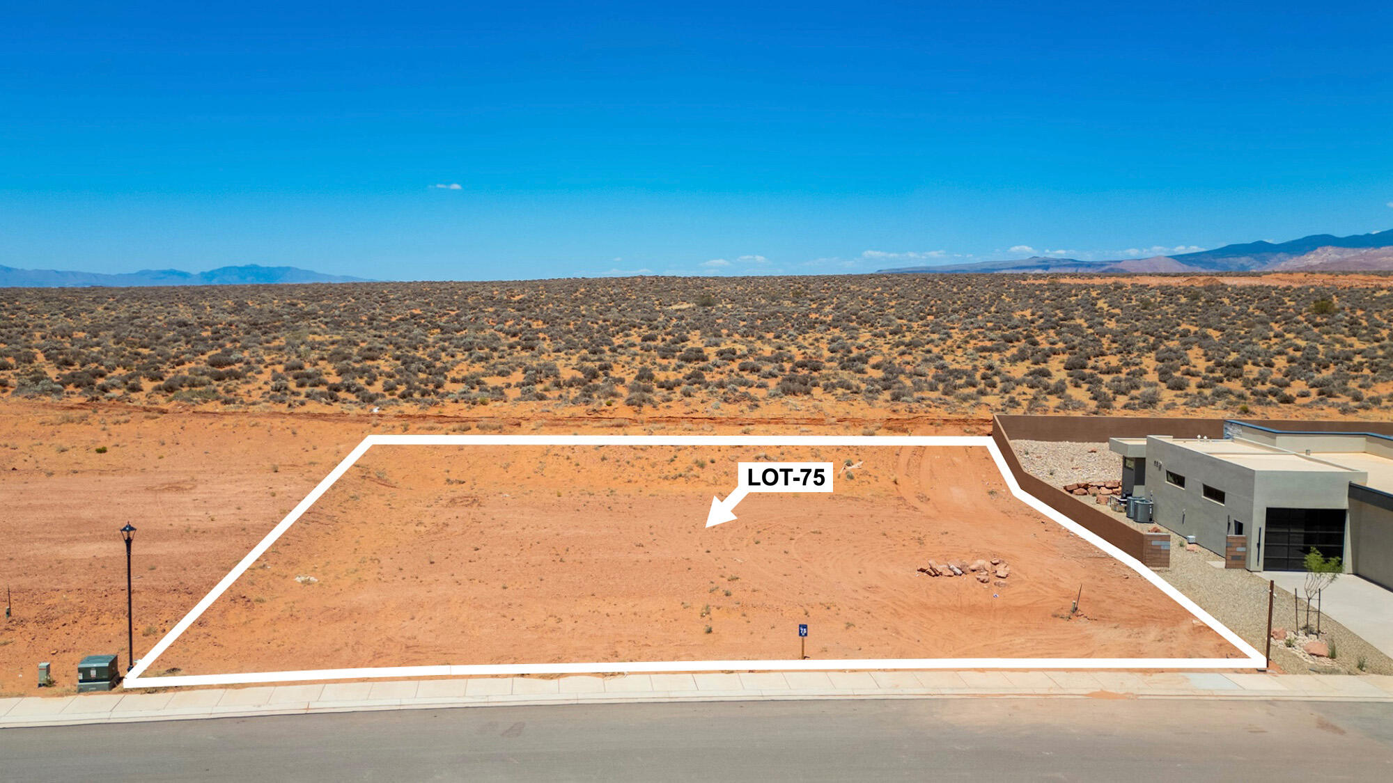 Build your dream home in one of Southern Utah's most sought-after resort communities. Lot #75 at The Estates at Sand Hollow offers approximately .43 acres and an exceptional opportunity to create a custom luxury residence surrounded by breathtaking red rock landscapes, championship golf, and endless outdoor recreation. Ideally situated within the community, this homesite provides ample space for a spacious floor plan, RV garage, pool, and outdoor entertaining areas designed to capture the beauty of the surrounding desert scenery.

Enjoy the perfect balance of privacy, open space, and resort-style living while being just minutes from Sand Hollow Reservoir, world-class golf, ATV trails, hiking, and Zion National Park. Ownership includes 40% off Championship Course green fees, discounts at The Grille and Pro Shop, plus 10% off Mad Moose UTV rentals. HOA amenities include professional landscaping maintenance and hourly security patrols, creating a low-maintenance, lock-and-leave lifestyle.

Choose from premier approved builders or bring your own builder to create a home tailored to your vision. Conveniently located just 15 minutes from St. George Regional Airport and approximately 90 minutes from Las Vegas, this community offers the perfect blend of luxury, adventure, and accessibility.

Don't miss one of the remaining opportunities to own and build within The Estates at Sand Hollow. Buyer to verify all information, including lot dimensions, building requirements, HOA information, utility connections, and all community amenities.