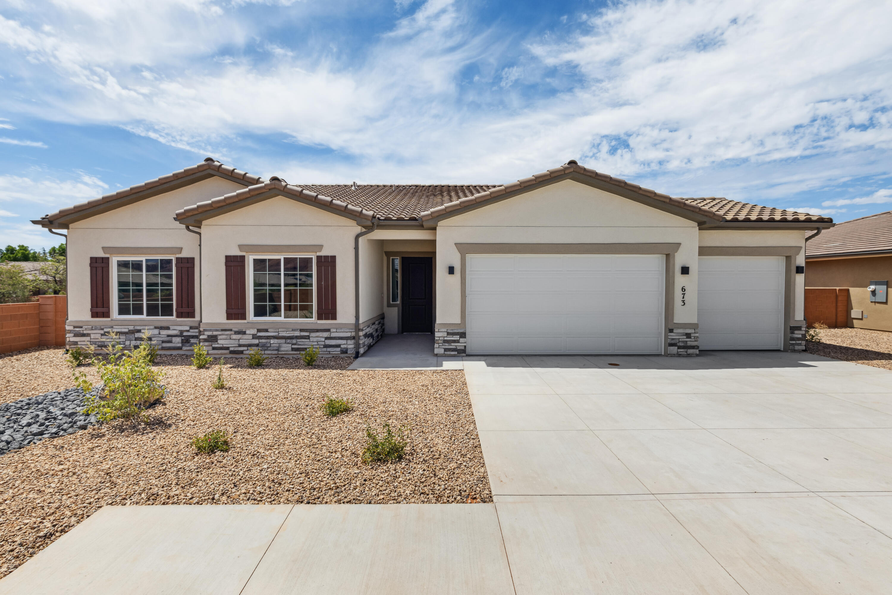 Surrounded by beautiful desert and mountain scenery. Fire Lake at Ivins Reservoir, Unity Park, and Kayenta Art Village are very close by. a short drive will get you to Tuacahn Ampitheater, Snow Canyon state park and Black Desert Golf Course and resort. This open and bright floorplan has a sunroom extension off the large kitchen. Enjoy quartz countertops throughout, a fireplace in the great room and a gourmet kitchen. It also has a shady covered patio off the back of the home.