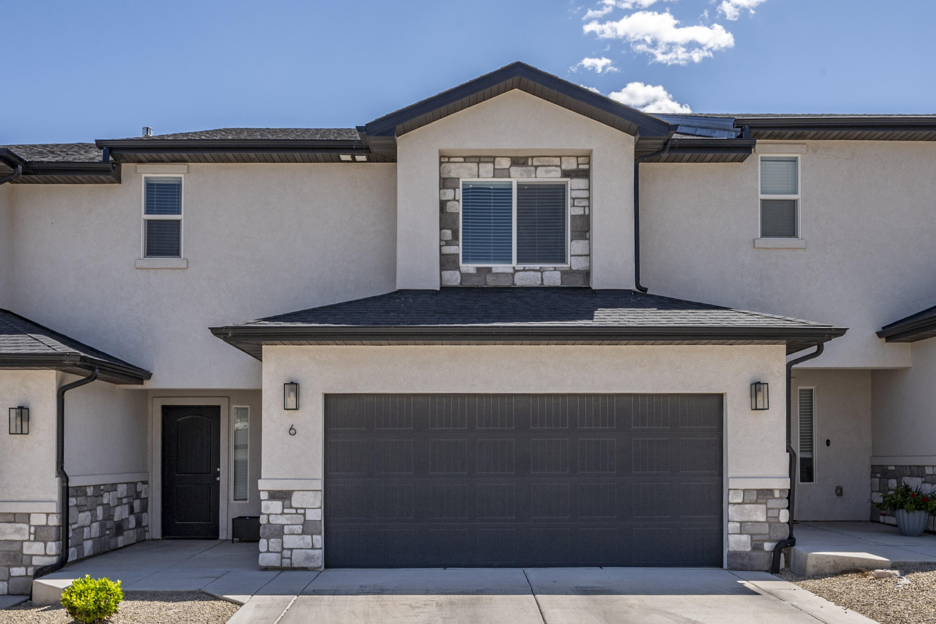 Built in 2022 and located in Shadow Cove subdivision, this modern townhouse offers a perfect blend of style and comfort. The interior features white cabinetry, granite countertops, and an open-concept kitchen with ample storage. The spacious primary suite includes a large walk-in closet, while the oversized laundry room provides additional storage. Enjoy outdoor living in the backyard with beautiful mountain views. Shadow Cove offers outstanding amenities, including a private dog park, pickleball and basketball courts, a playground, and a pavilion--ideal for relaxing and socializing. Whether seeking a first home, investment, or low-maintenance retreat, this property delivers exceptional value.