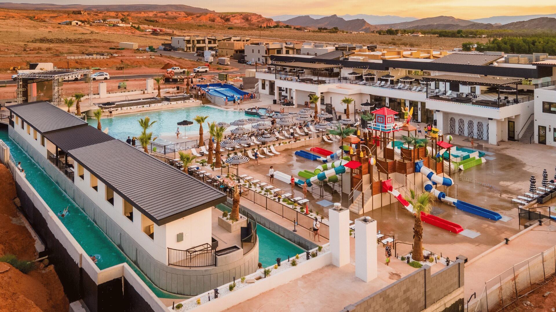 Top Airbnb Property, managed professionally by Cohosting, creates the perfect vacation property for your family. Use it whenever you want, nightly rent it when you don't for passive income and beautiful tax write-offs. Pecan Valley Resort is the funnest and most exciting nightly rental community in Southern Utah. Not only are the units incredibly well built (reach out for details), the amenities are second to none. A 10,000+ sq ft clubhouse with golf simulators, arcades, restaurant, event space, rooftop hot tubs and cabanas, 40ft slides, a surf machine, action river,  splash pad area, and more. Enjoy a vacation home for your family and create lasting memories, while also owning an appealing nightly rental investment property.  It's just a stones throw from Sand Hollow State Park, Quail Creek, the greater St George area, and Zions National Park. This resort is just getting started, and even more amenities are coming. Buyer to verify all info.