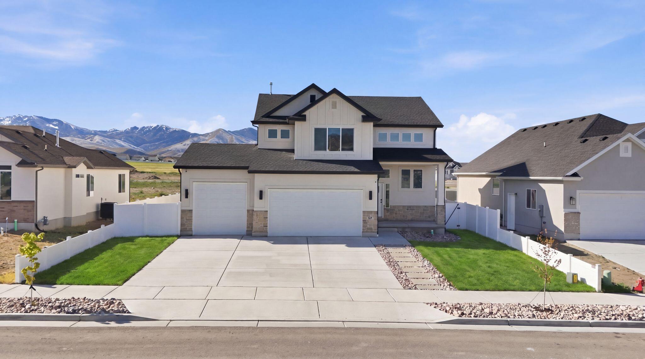 Custom 2 shorty home that offers the perfect blend of style, space and functionality. From the moment you arrive, the clean curb appeal, spacious driveway and 3 car garage set the tone for what's inside. Step into a bright open concept layout featuring LVP flooring, abundant natural light, a welcoming living room anchored by a modern fireplace. The modern kitchen includes a large island, sleek countertops, stainless appliances with gas stove and custom cabinetry. Upstairs, the spacious primary suite provides a relaxing retreat with vaulted ceilings and a spa like bathroom featuring dual vanities, a soaking tub, separate shower and a generous walk in closet. The unfinished basement offers incredible potential for future expansion. The fully fenced backyard provides plenty of room to enjoy the outdoors. Thoughtfully designed and move in ready!