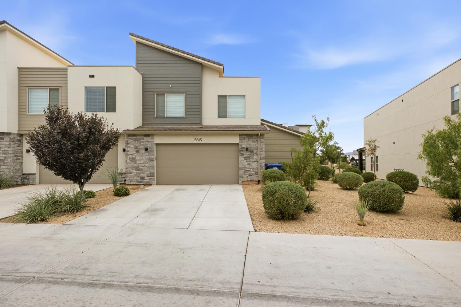 Welcome to this beautifully maintained 4-bedroom, 2.5-bath townhome in the highly sought-after Desert Color community. Thoughtfully designed for both comfort and convenience, this home features a desirable main-level primary suite, offering the ease of single-level living, while three additional bedrooms and a spacious second family room upstairs provide plenty of room for family, guests, a home office, or a playroom.

The open-concept main living area is filled with natural light and flows seamlessly into the kitchen and dining space, creating the perfect setting for everyday living and entertaining. A two-car garage and low-maintenance exterior make this home ideal as a primary residence, second home, or investment property.

As a Desert Color resident, you'll enjoy access to the community's incredible amenities, including the stunning 2.5-acre lagoon, resort-style pool, sandy beaches, pickleball courts, parks, walking trails, and year-round community events. Plus, with exciting new shopping, dining, and retail continuing to come to the area, you'll be perfectly positioned to enjoy one of St. George's fastest-growing and most desirable master-planned communities.

Come experience why Desert Color is one of Southern Utah's most sought-after communities, where resort-style amenities, everyday convenience, and an exceptional lifestyle come together.