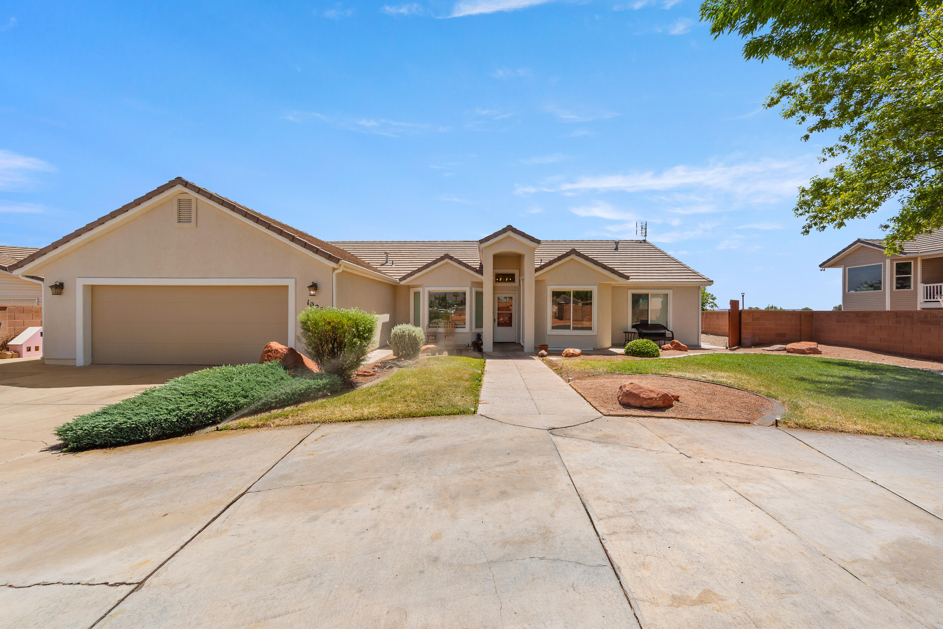 Lots of Light, Red Mountain Views, and Endless possibilities in this Charming
Home!! This attractive family home is located in the quiet and desirable Ivins neighborhood of Heritage Estates near Snow Canyon State Park, that will captivate
you the moment you arrive.
Thoughtfully designed floor plan includes 4 bedrooms, den or bonus room,
dedicated laundry room, walk-in pantry, and three full bathrooms all remodeled in
2023. Two separate spacious Master bedrooms are split across the home for
privacy and space to breathe. First Master bedroom boasts a walk in closet, and
large bathroom with separate shower and soaking tub. Second Master bedroom,
across the home to the other side, features two separate his and her closets, a full
bathroom, and its own access to the veranda out back. This second Master
Bedroom would also make a fantastic mother-in-law suite. Two generously sized
secondary bedrooms complete this beautiful home.
An inviting entryway to this home opens into a den or sitting room. The kitchen
includes stainless steel energy star appliances purchased 2023 with open concept
kitchen nook and breakfast bar transitioning into amply sized dining and living
rooms, making this great for entertaining or everyday family gatherings.
The home stucco exterior was freshly painted in 2026 and the front landscaping has
a welcoming front yard with circular driveway. The garage driveway is widened to
accommodate potential RV or boat parking. To the rear you will find a fully gated
yard and covered veranda opening to a xeriscape backyard, providing an ideal spot
to relax and unwind as you soak in those Red Mountain views during the day or
stargaze at night.
Beyond the front door, nature and activities unfold in every direction. This home is
ideally positioned within both biking or walking distance to Snow Canyon State Park
and Tuacahn Amphitheater, along with neighborhood shops and everyday
conveniences just minutes away. Enjoy Ivins' outdoors just minutes to the
trailheads - offering miles of hiking with sweeping views. This gem of a home is a bargain that is hard to match in the Ivins area, either for a family or investors.