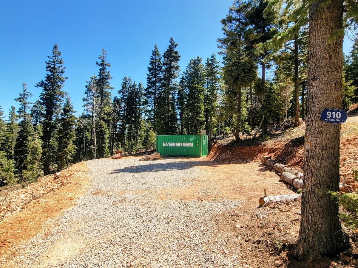 Come out to Zion View Mountain Estates also known as Strawberry Point and enjoy this .50 acre lot with tall pine and aspen trees. The lot is ready to camp on with your RV/Travel Trailer with a rocked driveway, septic system, and year round water provided through the Kane County Water Conservancy District system. Power is located in the street and the new owner could bring it on the lot. Access by vehicle is during the summer and fall months because the roads are not currently plowed during the winter time. Property owners snowmobile to the subdivision during the snow months. The lot has a gradual slope with some great views and is located on a cul-de-sac road with less traffic. There is a metal container to store the mountain toys on the property.