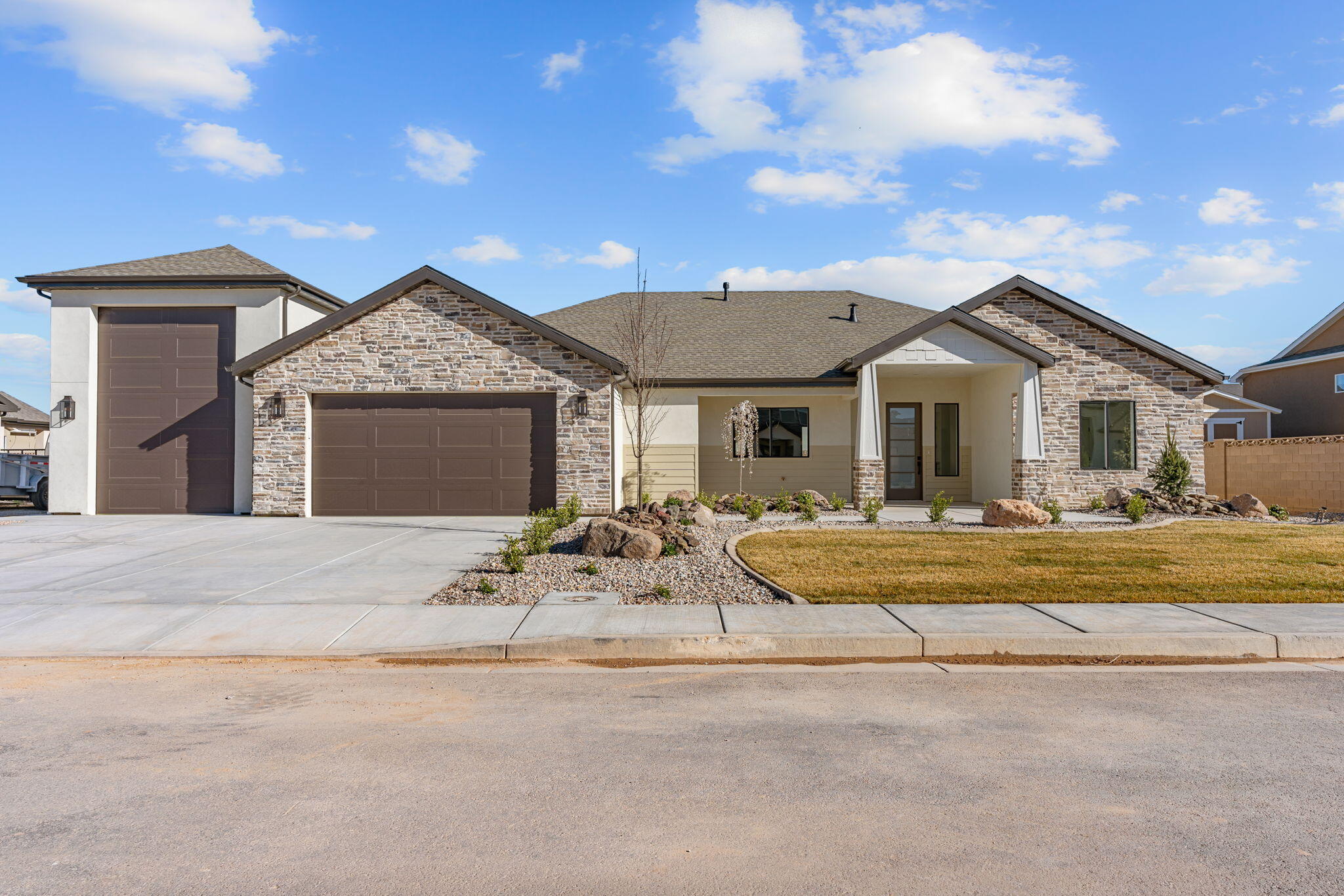 Brand new single-story home in the Iron West subdivision here in Cedar City! This 1,996 sq ft house offers 3 bedrooms, 2.5 bathrooms, and a super functional open floor plan.

The kitchen, dining, and living areas all flow together nicely under attractive coffered ceilings. The primary suite has its own private bath and a big walk-in closet, plus you get two more bedrooms, another full bath, a dedicated laundry room, and a nice-sized covered back patio.

One of the best features is the garage setup -- a standard 2-car garage plus a large separate RV garage. Plenty of room for trucks, toys, boats, or whatever you need.