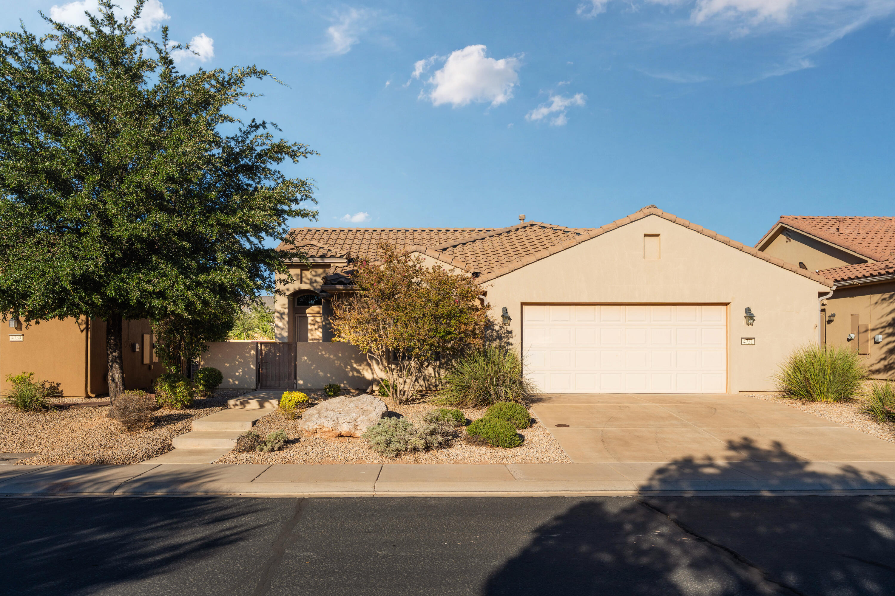 Move-in ready home in the desirable SunRiver 55+ community! This well-maintained 2-bedroom, 2-bath home features vaulted ceilings, hardwood floors and tile throughout (no carpet), granite kitchen countertops, stainless steel appliances, ceiling fans in every room, and top-down/bottom-up blinds for added privacy and natural light. Covered patio and xeriscaped backyard. Enjoy SunRiver's exceptional amenities, including golf, indoor and outdoor pools, fitness center, pickleball and tennis courts, walking trails, clubhouse, and an active social calendar. Experience the best of low-maintenance living in one of St. George's premier active adult communities!