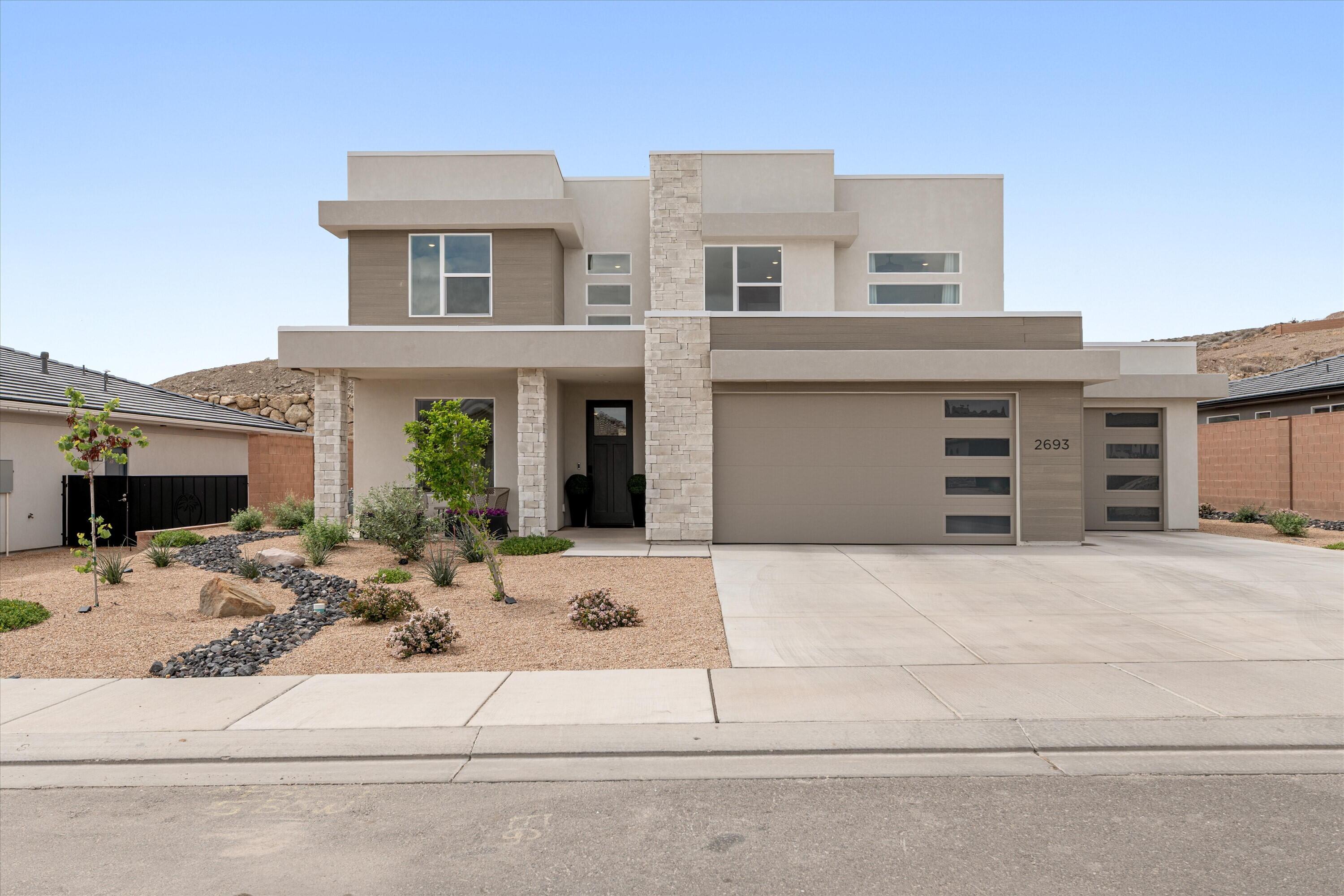 Tucked within the peaceful and highly desirable Divario community, this property offers stunning city views and a rare level of privacy with no homes behind you. The adjoining BLM land is designated to become a Desert Tortoise Reserve, helping preserve the natural landscape, ensuring your secluded privacy, and protecting your views.

The home features a well-designed floor plan that balances everyday comfort with practical living, all set against a beautiful Southern Utah backdrop. Enjoy the rare convenience of being within walking distance to some of Southern Utah's most renowned climbing areas and highly popular mountain biking trails--an outdoor enthusiast's dream.

An oversized three-car garage, combined with additional space for side parking, provides ample room for vehicles, trailers, and recreational gear. Built with 2x6 construction and upgraded insulation, the home offers improved energy efficiency to help maintain comfort throughout the seasons.

Opportunities like this--offering privacy, protected land behind the home, and close access to world-class outdoor recreation--are increasingly hard to find in the St. George area.