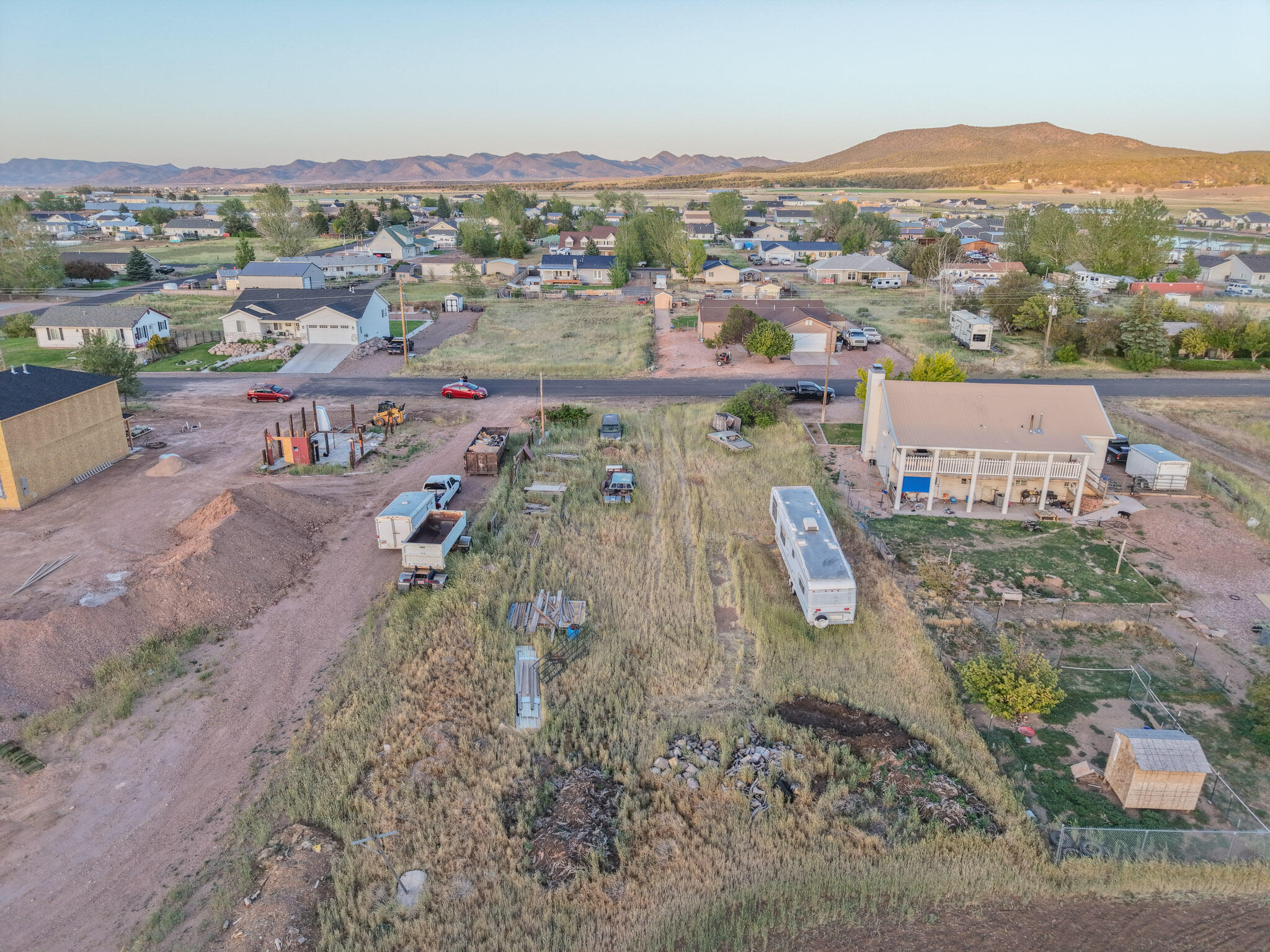 Great 0.3 acre Lot positioned in the heart of Enterprise!  It is near impossible to find a better way of life.  Half a block to the amazing city park and close to the Library, Little League fields and schools. 
Bring your dream home plan and position it on this prime piece of Enterprise Real Estate.  Slight grade could accomidate a walk-out basement build.  Approximately 80'x163'   City Power/Water/Sewer and Gas available at lot edge. 5G Fiber also available.  If you have been waiting for a signal, This Is It!  Opportunity awaits!!
 (Miscilaneous items to be removed shortly)