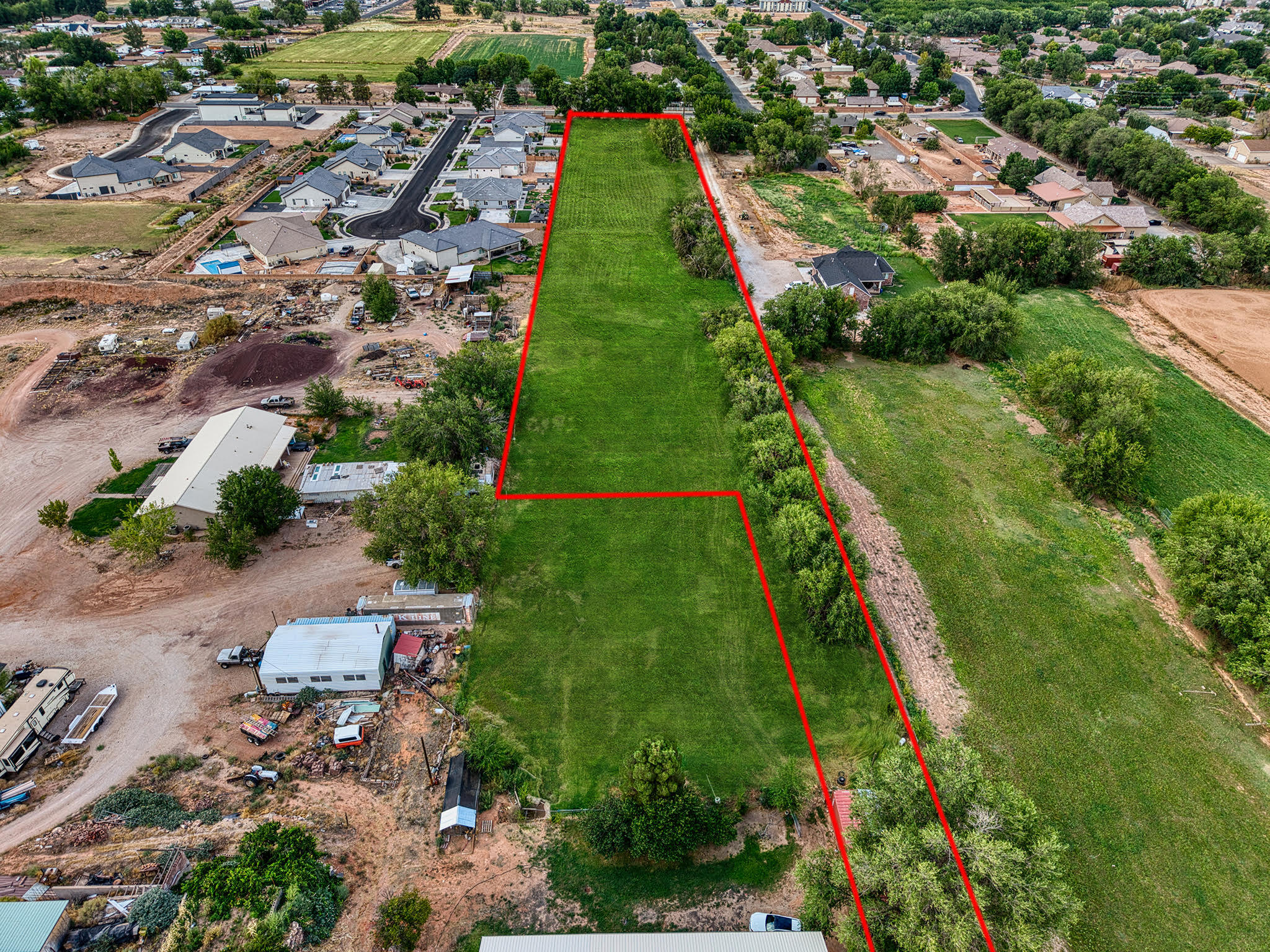 An amazing chance to own a large piece of paradise in Southern Utah! This property is a developer's vision or ranch owner's dream. With utilities already on-site, the hard work is done—just bring your plans.

Mature trees line the land, creating both beauty and privacy, while 3.5 primary shares in the Hurricane Canal Company ensure you'll always have plenty of water—whether for crops, pasture, or livestock. And let's not forget the unbeatable views that surround you from every angle.

Whether you're ready to build a development, establish your dream ranch, or simply secure an investment in one of Utah's most desirable areas, this property is ready to deliver.