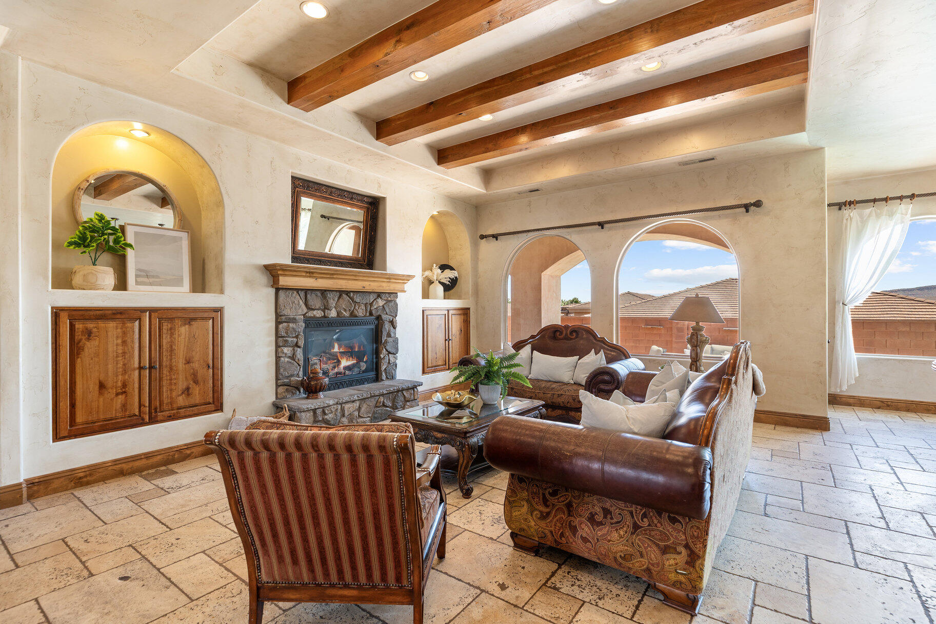 Incredible opportunity to own a home that the bank has appraised for almost $2m in beautiful Ivins. Your perfect Tuscany retreat in the heart of Ivins awaits! This home truly has it all -- from the sparkling pool and private courtyard with gorgeous views, to the oversized 4-car garage that fits all your gear. The home features a remarkable multi-level layout perfect for entertaining and creating memories with family and friends. At the entrance, you are welcome by the serene sounds of the water feature in the large courtyard. Once you walk through the large arch glass wooden doors, you will experience a large open floor concept that includes the large upstairs living room, kitchen, and dining area with large mountain view windows. The home features 5,544 SqFt (2,772 in each floor), 6 bedrooms, 6 bathrooms, theater room, 2x flex rooms, Office/Den, large storage room, granite honed edge countertops throughout, and wood beam living room ceilings. Inside, the kitchen is a chef's delight with large multi-tier island, a built-in fridge, and a hidden pantry big enough for all your needs, knotty alder cabinets, 6 burner chef freestanding stove, and built-in swivel island chairs. The spacious primary bedroom is a relaxing escape, complete with its own secluded flex room, a custom built-in closet, a spa-like bath with a triple-head shower, separate soaking tub, and large sauna room. The finished basement has a large 2nd living room that is perfect for a game room. Movie nights? This home has you covered, thanks to your very own theater room. You'll also love the large mudroom, laundry space, kitchenette, and a den perfect for work or hobbies. The outdoor space is a wonderful entertainment space with Outside, fire up the built-in barbecue and fridge under the covered patio, and enjoy effortless entertaining.


The home is near the Greater Saint George paved bike/walking trail system with over 50 miles that connects you across the city, including the iconic Snow Canyon State Park, Sullivan Soccer Park, and miles of beautiful Red Rock terrain. Minutes from amenities in downtown Saint George, such as over 16 golf courses including Black Desert Golf Course home to the Fall 2024 PGA TOUR's FedEx Cup, hiking and cycling trails, and a short drive to some of America's most awe-inspiring places; National parks Zion, Bryce and the north rim of the Grand Canyon, and state parks like Sand Hollow Reservoir, Gunlock Reservoir, Quail Creek Reservoir, and nearby Dixie National Forest. The City of Ivins is known for its low light pollution initiative to protect its night sky and for its breathtaking views of Red Mountain. There is no doubt that the word is out that at 2,700 feet above sea level, on the edge of the Mojave desert, Colorado Plateau, and the Great Basin, lies one of America's most beautiful and distinctively geological places, Saint George! No other place says that you have arrived than this beautiful home.

All information herein is deemed reliable but is not guaranteed. The buyer is responsible to verify all listing information, including square feet/acreage, to the buyer's own satisfaction.
