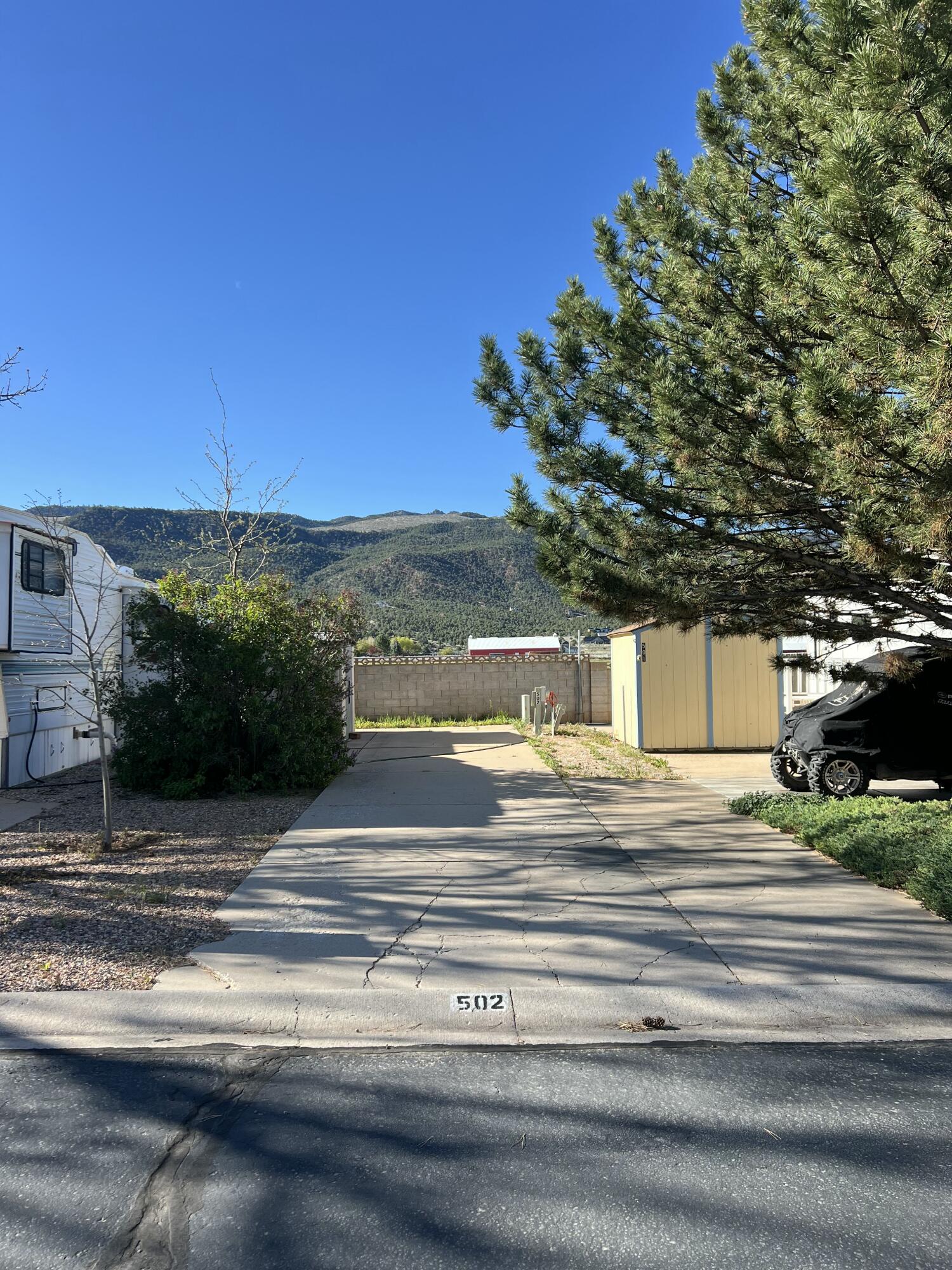 Premier RV Lot for sale in Foothills RV Park. Why rent an RV spot when you could buy? This rare, premier lot borders the outside edge of the park for spectacular mountain views! The lot is fully equipped with a storage shed, water, power, and sewer hookups. Low monthly HOA fees of $109/month cover snow removal, water, sewer and garbage. Foothills RV Park offers a quiet, clean community of just 146 lots, complete with its own clubhouse. The clubhouse offers laundry, showers, and a kitchen. Located in rural Parowan near top outdoor recreation--skiing, mountain biking, fishing, snowmobiling, ATV trails, and hunting. This is the perfect base for adventure seekers.