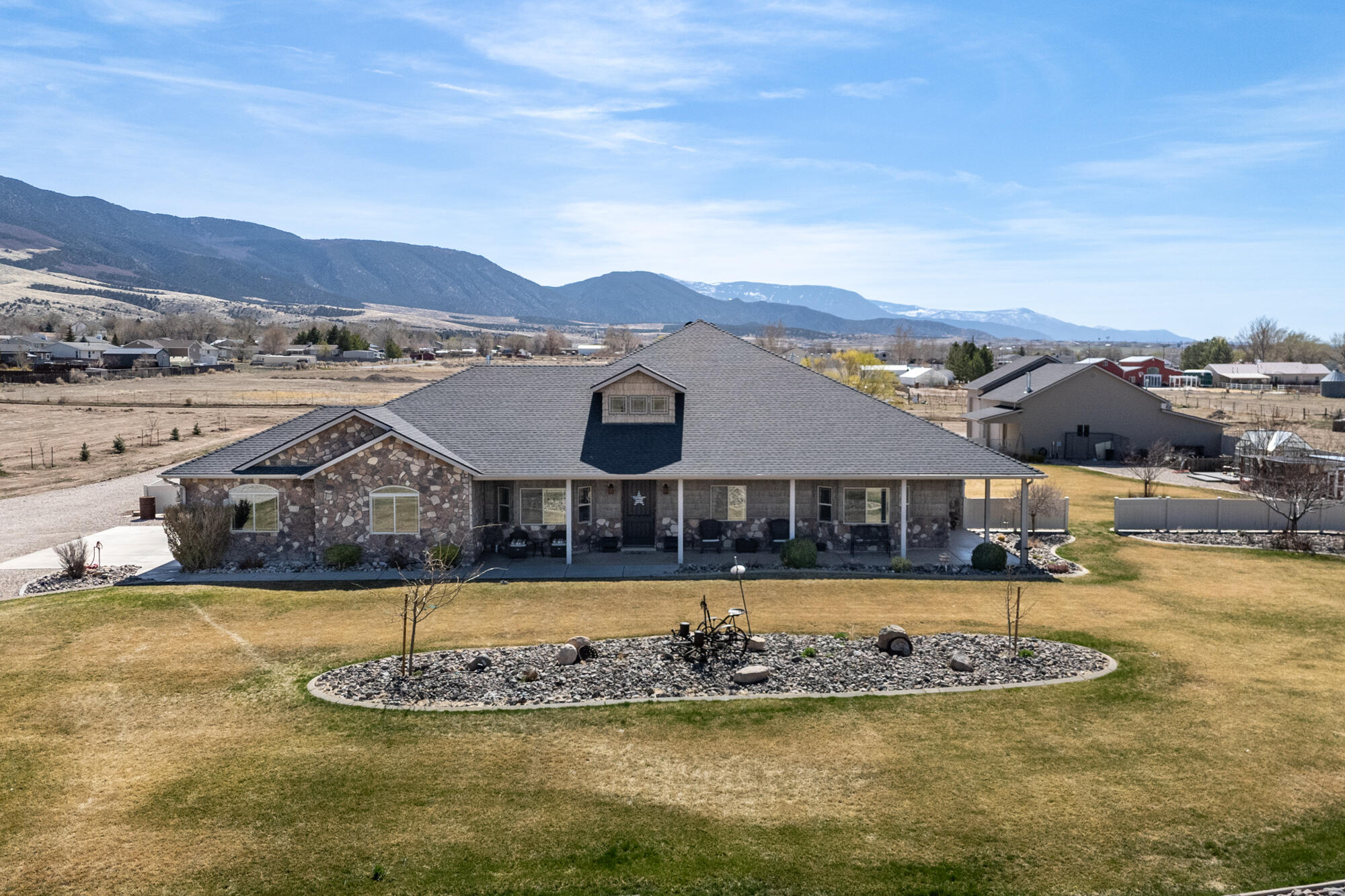 Stunning 5-bedroom, 3-bath ranch-style home on one level, set on 6 fully fenced and cross-fenced acres. This beautifully upgraded property features timeless engineered hardwood floors, solid core doors, and abundant built-in cabinetry. The gourmet kitchen offers a prep sink, double ovens, and high-end appliances, including a Kenmore Pro commercial refrigerator. Enjoy spacious living with a 2-car attached garage plus an impressive 6-car RV garage/workshop complete with a reloading room. Outside, you'll find mature trees, a greenhouse, chicken coop, fire pit, RV parking, and even a 100-yard archery range--perfect for country living at its finest.
