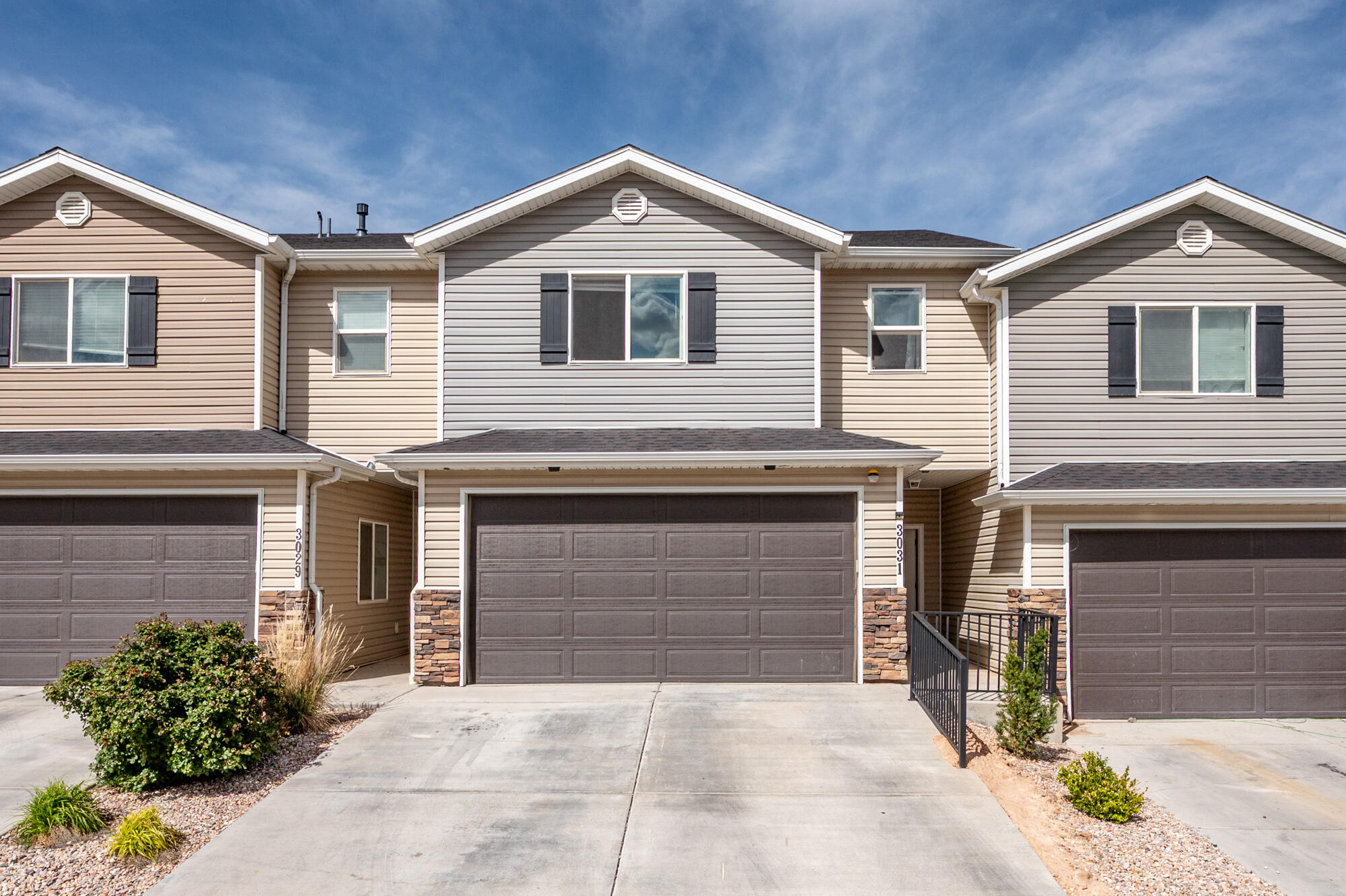 One of the best homes in the community! Backing to open field space with a larger yard offers added privacy and peaceful sunset views from your back covered patio. Enjoy outdoor living without the upkeep with community green space, basketball court, grassy play area, and covered picnic table. Inside features 3 bedrooms, 2.5 baths, 9 foot ceilings, and a thoughtful layout. Kitchen includes quality finishes, pendant lighting, and a large corner pantry. Spacious primary suite with dual sinks and a walk-in closet. ALL appliances are included. Attached 2-car garage and quick I-15 access make this a standout!