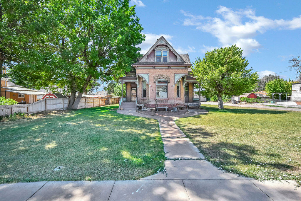Rare opportunity to own one of downtown Richfield's historic gems featuring an incredible 2,019 sq. ft. detached RV garage and workshop--an exceptionally rare find offering endless possibilities for RV storage, hobbies, vehicles, or a home workshop.

This charming home blends timeless character with today's modern conveniences. Original details include the brick exterior, trim, fireplace, baseboards, casings, and several vintage light fixtures, while major updates include new plumbing and electrical, beautiful hardwood floors, and a new furnace and water heater installed within the past six months.

Situated just one block from the elementary school, the property also offers mature fruit trees, a garden area, and plenty of outdoor space to enjoy. If you've been searching for historic charm, modern updates, and an unmatched garage, this one-of-a-kind property is not to be missed.

AGENT RELATED TO SELLER