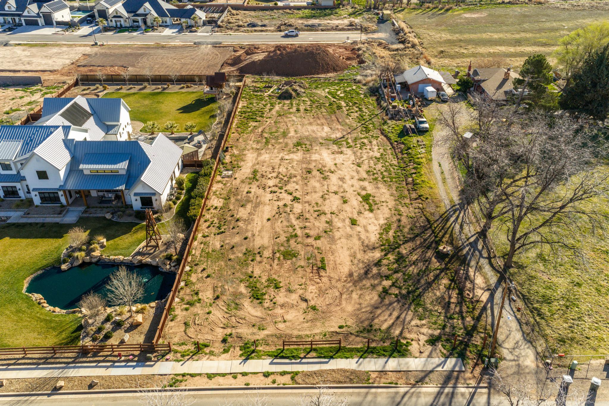 *Zoned for Casita-Rental Income Opportunity + Primary Home | USDA Land Loans Available* Build your dream home with added income potential on this .86-acre fully usable, flat lot in Hurricane. Property is zoned to allow a casita (ADU)-ideal for rental income, guest space, or multi-generational living. Flat desirable lot ready for build all utilities stubbed. Located just minutes from Sand Hollow Reservoir, Quail Lake, and Zion National Park just 30 minutes away. Seller has building plans available upon request. Zoned Residential and Agriculture-Horses Welcome
