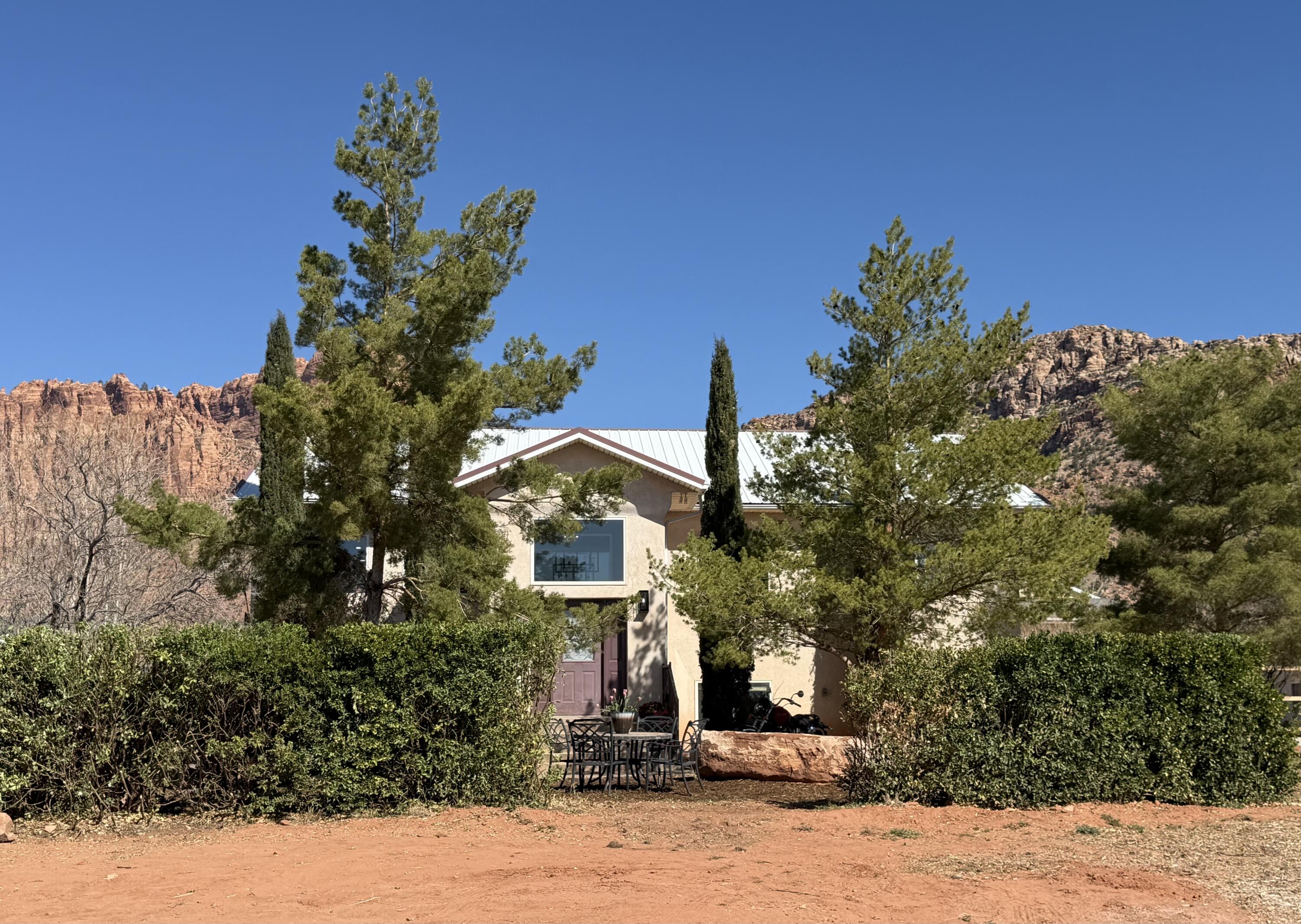 Nestled beneath the gorgeous cliffs, this home boasts room for growth, investment or personal. The split level floor plan has 2 kitchens, 2 primary suites, 2 living areas. One on each floor, plus the 3 bed/2 bath on each floor. ICF framing. Basement apartment has separate entrance or option to have open to both areas. SO many possibilities.