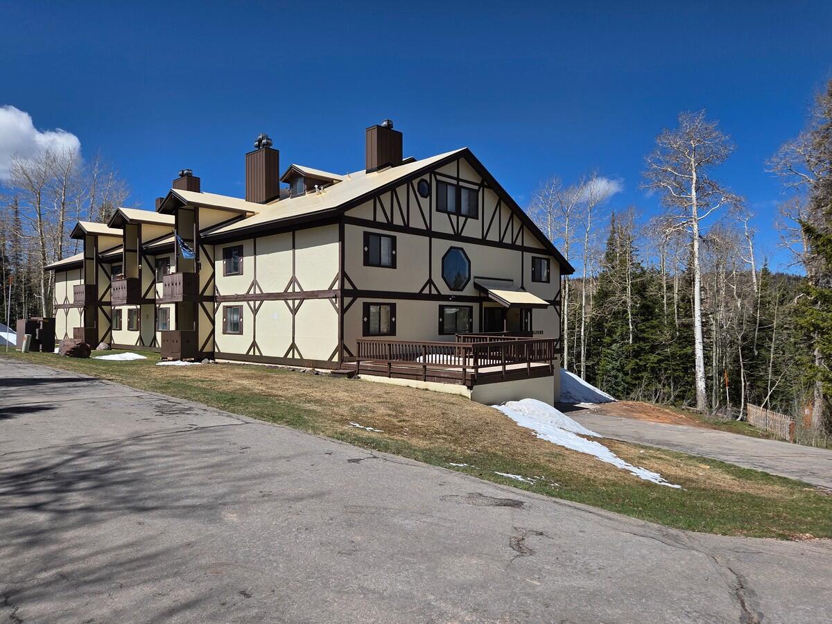 Tucked among the aspens for added privacy, this beautifully updated and spacious condo is just minutes from skiing and downtown Brian Head. The open main level is filled with natural light, showcasing great views and vaulted ceilings that enhance the sense of space. It features LVP flooring throughout the main floor, a well-designed kitchen, a full bathroom, and a private covered balcony. The large master suite includes a soaking tub and double sinks, while the loft offers a queen bed and bunk beds, comfortably sleeping up to six. Additional perks include a storage closet next to the unit, a ski and gear locker, shared laundry, designated garage parking, and unlimited firewood provided by the HOA. Whether you're looking for a nightly rental or your own mountain getaway, this turnkey property comes fully furnished and ready to enjoy. Located at 10,000 feet, Brian Head Resort is known for family-friendly skiing and snowboarding, along with snowmobiling, tubing, cross-country skiing, and recreational racing. In the warmer months, the surrounding mountains and forests offer exceptional opportunities for mountain biking, ATV riding, and rock climbing.