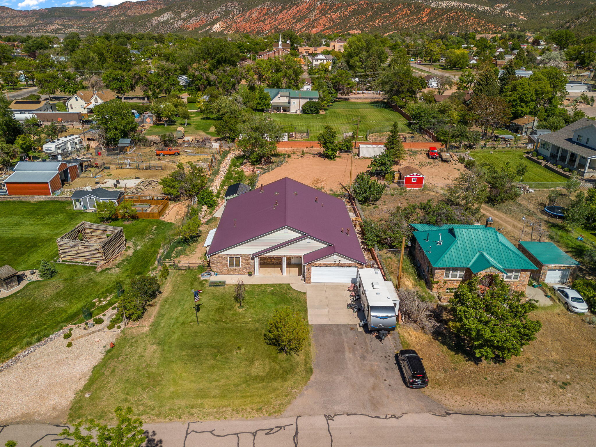 Spacious ranch-style home on 0.71 acres with incredible mountain views! This 3,189 SF home offers 4 bedrooms and 4.5 bathrooms, vaulted ceilings, granite countertops, a spacious primary suite with a walk-in closet, walk-in pantry, wood-burning fireplace/stove, and comfortable single-level living. Each bedroom features its own private bathroom suite with low-threshold walk-in showers, and low-threshold entries throughout the home provide added accessibility. Recent updates include brand-new carpet in the primary and middle bedrooms, newer carpet throughout the remainder of the home (September 2024), a brand-new stove, and a new garbage disposal. Additional features include a whole-house hot water recirculation system, attached 2-car garage, covered patio, mature landscaping, fruit trees, workshop, storage shed, RV parking/access, animal rights, and a permanent easement providing backyard access.

Conveniently located with year-round access and all city utilities while offering the peaceful feel of country living, this property provides plenty of room for hobbies, animals, recreation, or future improvements. Buyer to verify all information.