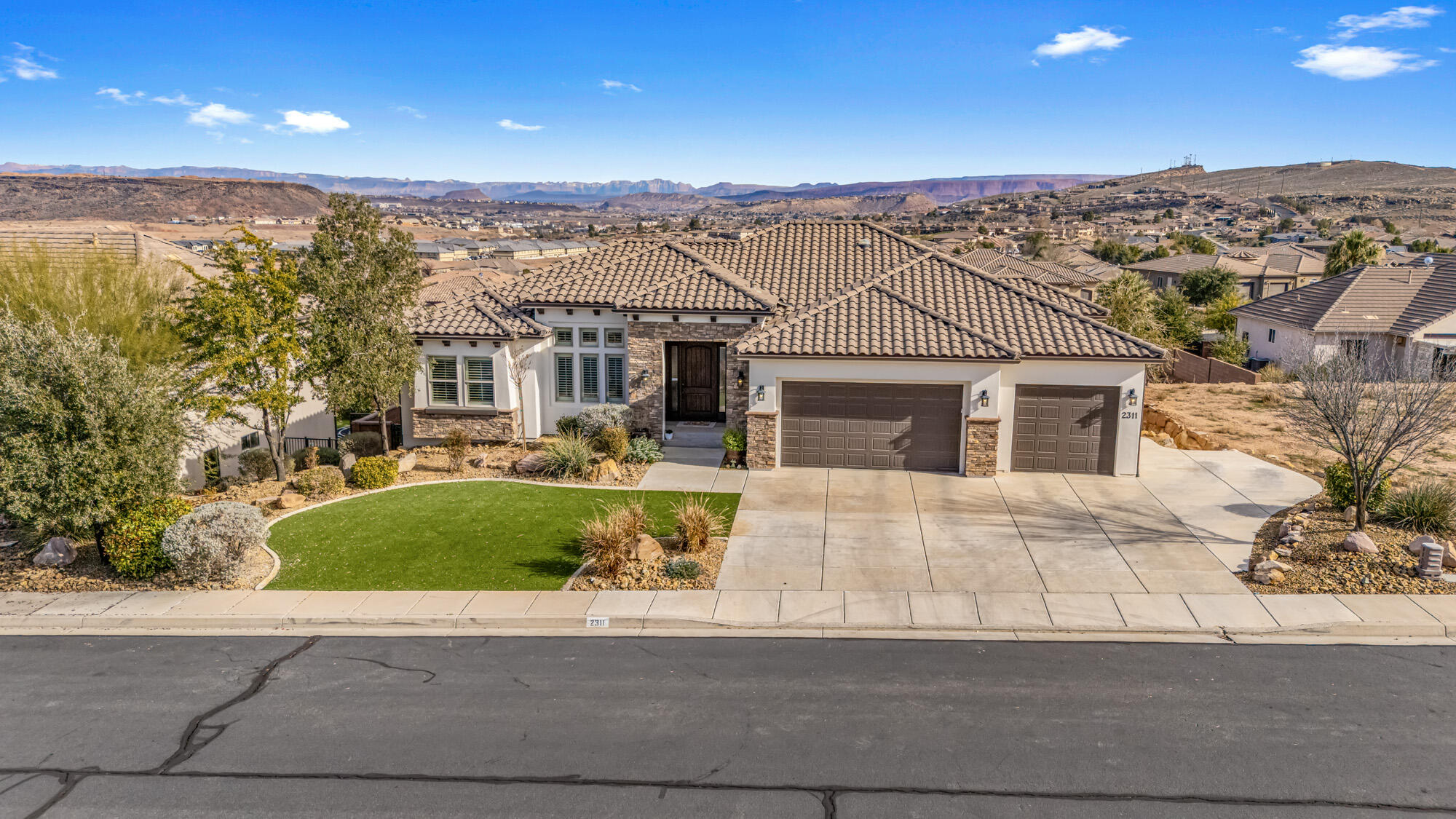 Beautifully upgraded move in ready home in the highly sought after Tonaquint Terrace subdivision!  Sit back and enjoy the unobstructed views from this very well kept, walk-out basement home Home featuring 6 bedrooms, 3 baths, formal living room, family room, rec room, office, theater room / gym, granite/quartz counters, stainless appliances, plantation shutters, like new therapeutic Bullfrog spa, spacious primary bedroom with sitting area, central vac, low maintenance landscaping, No HOA!!  Call to setup showing today!