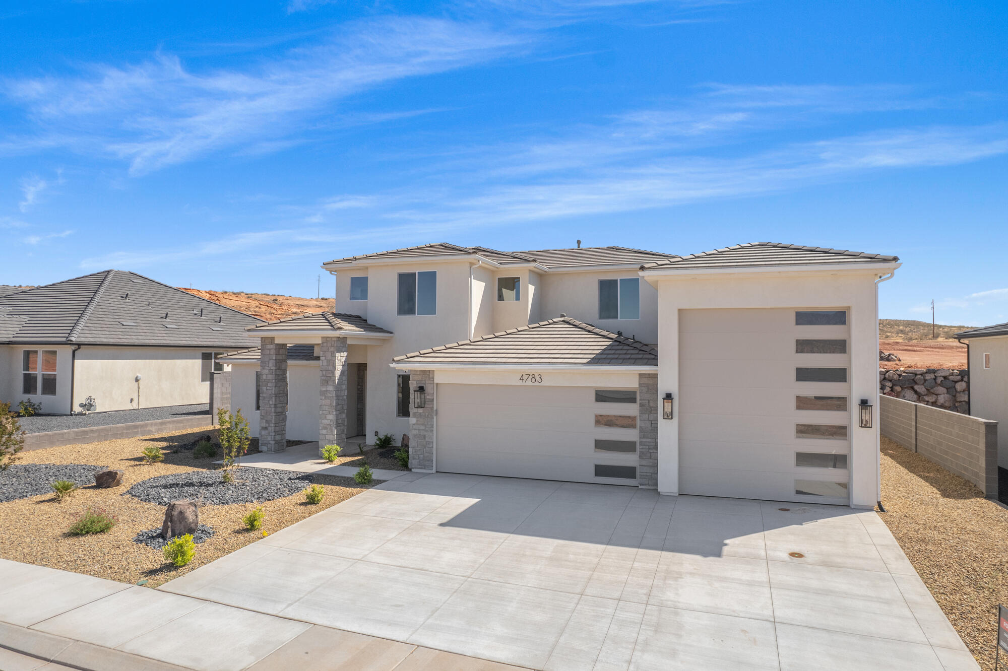 ~52' DEEP RV GARAGE~ 

FULL LANDSCAPING INCLUDED

This stunning 2 LEVEL home in Sand Hollow Village has a massive 52-FOOT DEEP RV GARAGE (12' wide x 14' tall door)! 

THIS IS IDEAL FOR: an adventure lover who needs a 52-ft deep RV garage for their toys, values luxury finishes, and wants to unwind in a spacious backyard just minutes from Sand Hollow's dunes and lake.

Ask about adding a pool!

Smart Home: This property comes equipped with premium SMART HOME features including 3 wired in insecurity cameras and a door bell camera. Just minutes from Sand Hollow Reservoir, Sand Hollow Golf Course, the sand dunes, and Zion National Park, you're surrounded by year-round adventure! Contact the Listing Agent for a private showing or to ask about additional incentives and options!
