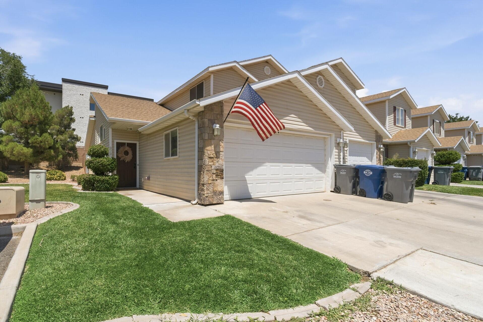 Well-maintained end-unit home in Pecan Meadows, offering one of the largest private backyards in the community with adjacent common yard space along the side for added openness and privacy. Inside, you find vaulted ceilings and a sliding glass door that create a bright and open feel, while painted cabinets and stainless steel appliances bring a clean, modern touch to the kitchen. Ceiling fans in every room add comfort throughout the home. The main-level primary suite features a walk-in closet and private bath with double sinks. Upstairs, you'll find a full bathroom for the additional two bedrooms. A spacious 2-car garage includes built-in wood shelving for convenient storage. Enjoy low-maintenance living with exterior insurance and yard maintenance covered by the HOA. With its exceptional private yard, garage space, end-unit setting, and thoughtful upgrades, this home is a standout opportunity in the heart of Hurricane. Buyer to verify all information, deemed reliable, however buyer to verify all info including utilities, rental restrictions, and HOA information if applicable.