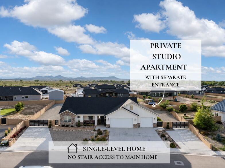 Welcome to this beautifully upgraded custom home offering the rare combination of luxury, flexibility, and income potential. The main home lives entirely on one level- no stairs are required for every day living. One of the standout features is the private studio above the garage, complete with its own private entrance, full bathroom, laundry, kitchenette, storage closet, and space for a mini refrigerator. Whether you're looking for a guest suite, college student housing, multigenerational living, home business, or private office, this space offers endless possibilities.

Inside the home you will find spacious gathering areas designed for entertaining, a huge walk-in-pantry, new quartz countertops, updated lighting, custom mirrors, and durable vinyl plank flooring throughout.

Step outside to professionally completed landscaping featuring paver walkways, flagstone accents, mature peach, apple, and apricot trees, covered patio stretching the full length of the home with access from both the dining area and primary suite.

Need room for toys? This property features TWO concrete driveways, gated backyard access, and a reinforced south driveway built to accommodate heavy trailers or future shop you've been dreaming about.

Home offering this combination of RV parking, income potential. custom upgrades, and flexible living space rarely become available.

This home actually checks all the boxes!
- Single-level main home
- Private studio apartment with separate entrance
- RV & Trailer Parking
- TWO concrete driveways
- Shop potential
- Covered Patio
- Custom upgrades throughout
- Established fruit trees
- Flexible living with income potential