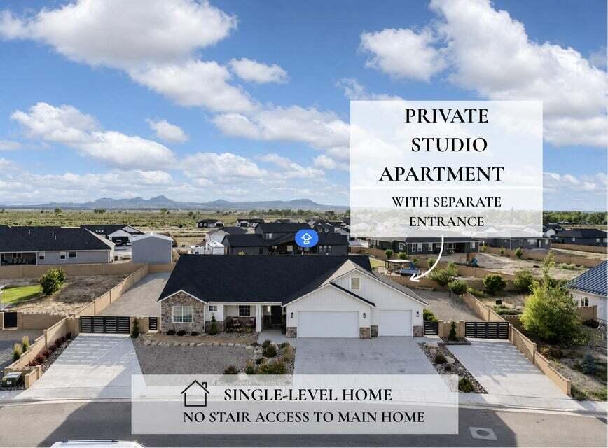 Welcome to this beautifully upgraded custom home offering the rare combination of luxury, flexibility, and income potential. The main home lives entirely on one level- no stairs are required for every day living. One of the standout features is the private studio above the garage, complete with its own private entrance, full bathroom, laundry, kitchenette, storage closet, and space for a mini refrigerator. Whether you're looking for a guest suite, college student housing, multigenerational living, home business, or private office, this space offers endless possibilities.

Inside the home you will find spacious gathering areas designed for entertaining, a huge walk-in-pantry, new quartz countertops, updated lighting, custom mirrors, and durable vinyl plank flooring throughout.

Step outside to professionally completed landscaping featuring paver walkways, flagstone accents, mature peach, apple, and apricot trees, covered patio stretching the full length of the home with access from both the dining area and primary suite.

Need room for toys? This property features TWO concrete driveways, gated backyard access, and a reinforced south driveway built to accommodate heavy trailers or future shop you've been dreaming about.

Home offering this combination of RV parking, income potential. custom upgrades, and flexible living space rarely become available.

This home actually checks all the boxes!
- Single-level main home
- Private studio apartment with separate entrance
- RV & Trailer Parking
- TWO concrete driveways
- Shop potential
- Covered Patio
- Custom upgrades throughout
- Established fruit trees
- Flexible living with income potential