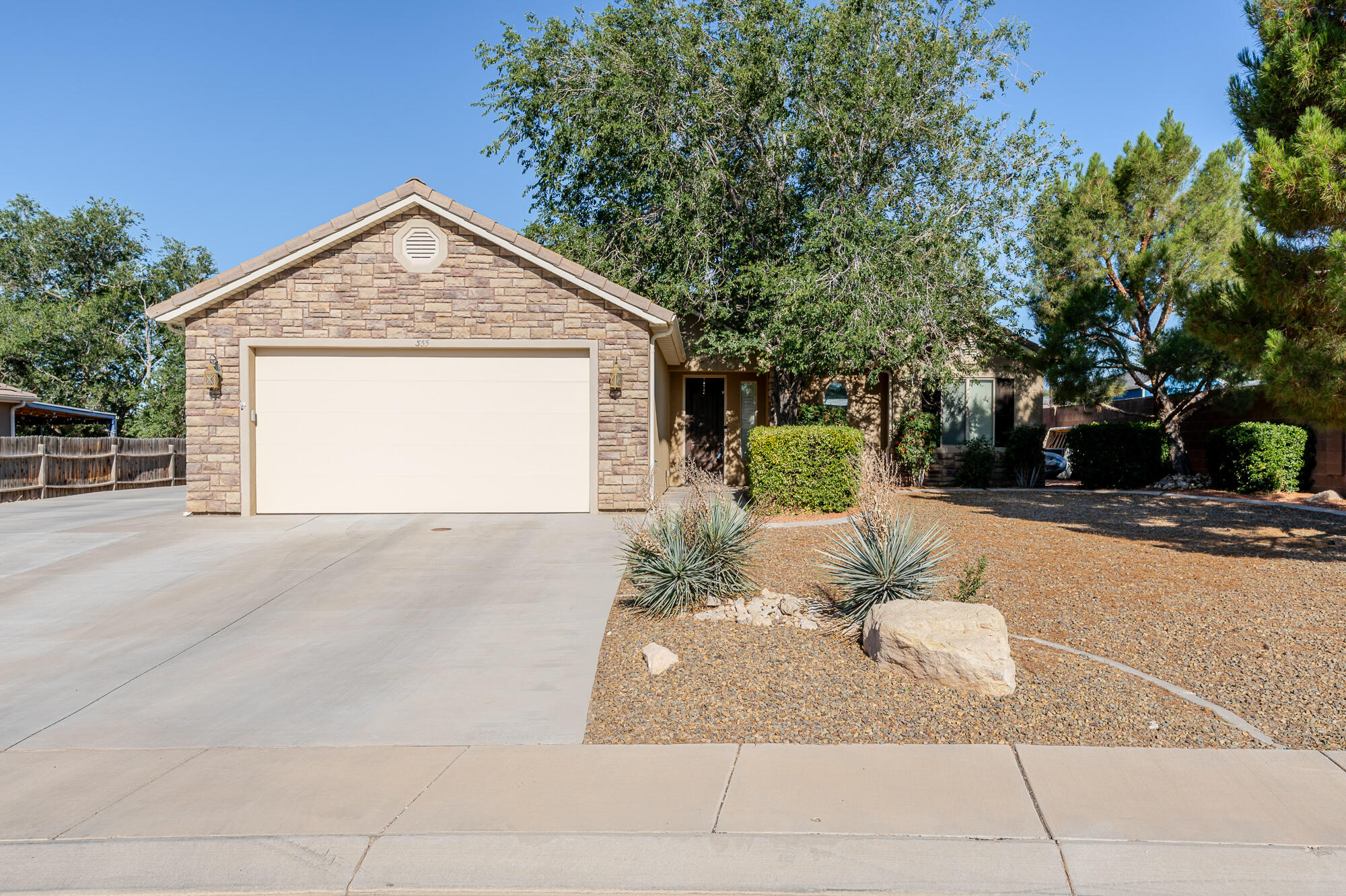 Single-level home in Fox Hollow with beautiful mountain and valley views.
This 2009 built house sits on a quiet street in Hurricane. The 1,295 sq ft layout includes three bedrooms and two bathrooms, all on one level. The kitchen comes equipped with the fridge, dishwasher, and microwave, and it opens nicely into the living area. The primary bedroom features a jetted tub and walk-in closet. Out back you'll find a fully landscaped yard with automatic sprinklers, a covered patio, and a storage shed, plenty of space to relax or entertain. Two car garage with extra room for RV parking.
The location is tough to beat. Hurricane is right in the middle of Southern Utah's best spots. Zion National Park is just a 30 minute drive away for world class hiking, canyons, and those stunning red rock views. Right nearby you have local trails like Three Falls and West Cinder Knoll, plus Sand Hollow State Park for reservoir swimming, boating, and more red rock adventures.
Local eats are solid too, grab Mexican at La Fonda Grill, wood fired pizza at The Pizza Wagon, or any of the other good spots around town. It's the perfect setup: spend your day exploring Zion or the surrounding trails and still be home in time for dinner without a long commute.
No crazy HOA fees, central air, tile roof, and easy access to St. George. A well maintained, move in ready home.