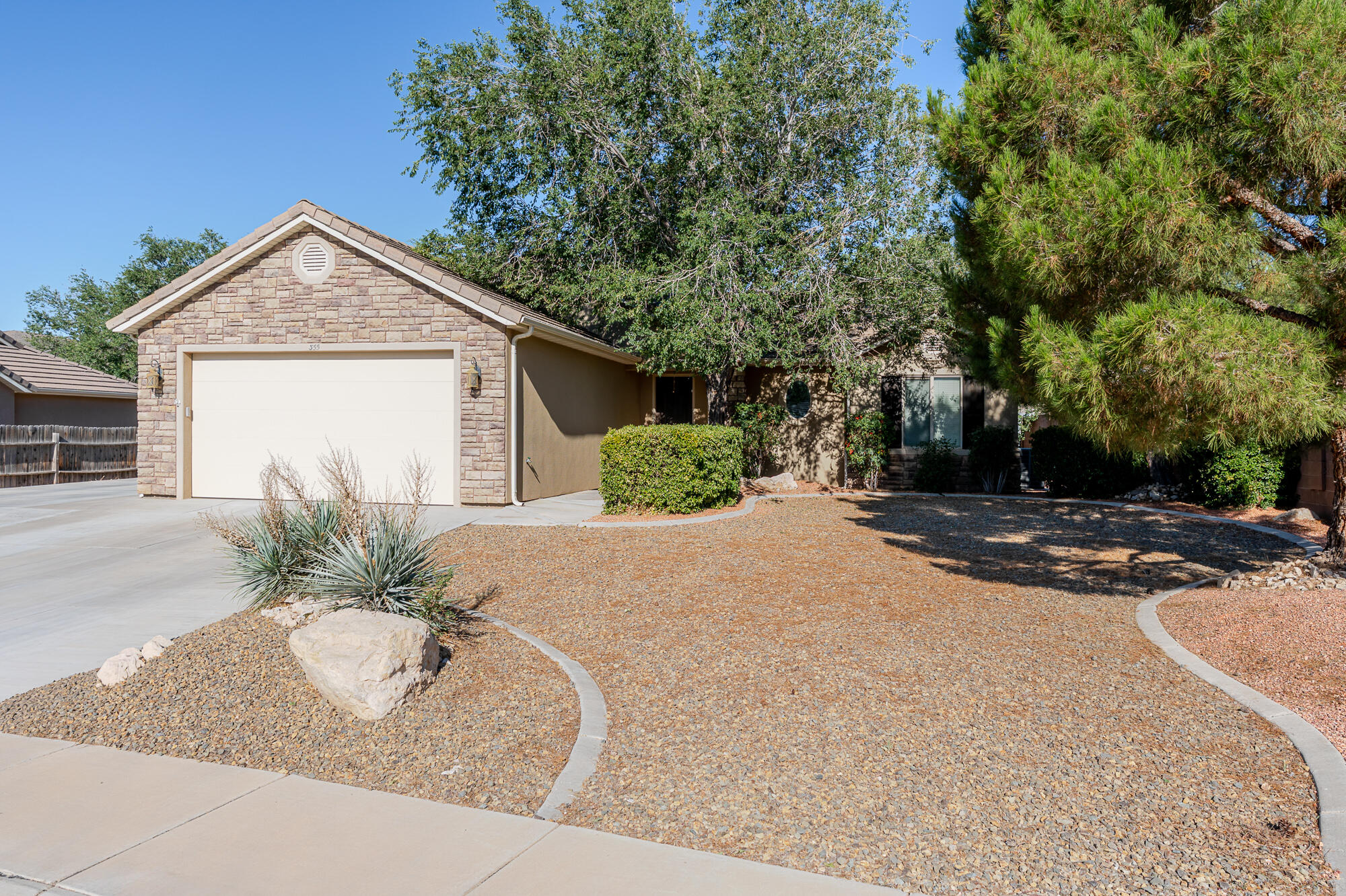 Single-level home in Fox Hollow with beautiful mountain and valley views.
This 2009 built house sits on a quiet street in Hurricane. The 1,295 sq ft layout includes three bedrooms and two bathrooms, all on one level. The kitchen comes equipped with the fridge, dishwasher, and microwave, and it opens nicely into the living area. The primary bedroom features a jetted tub and walk-in closet. Out back you'll find a fully landscaped yard with automatic sprinklers, a covered patio, and a storage shed, plenty of space to relax or entertain. Two car garage with extra room for RV parking.
The location is tough to beat. Hurricane is right in the middle of Southern Utah's best spots. Zion National Park is just a 30 minute drive away for world class hiking, canyons, and those stunning red rock views. Right nearby you have local trails like Three Falls and West Cinder Knoll, plus Sand Hollow State Park for reservoir swimming, boating, and more red rock adventures.
Local eats are solid too, grab Mexican at La Fonda Grill, wood fired pizza at The Pizza Wagon, or any of the other good spots around town. It's the perfect setup: spend your day exploring Zion or the surrounding trails and still be home in time for dinner without a long commute.
No crazy HOA fees, central air, tile roof, and easy access to St. George. A well maintained, move in ready home.