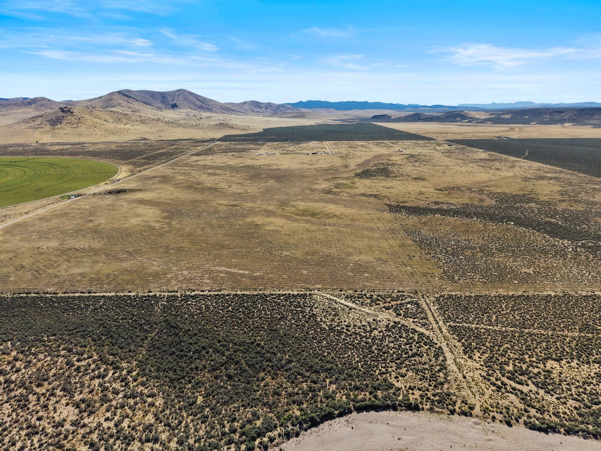 Escape to the peace, privacy, and natural beauty of rural living with this exceptional 20.22-acre property. Showcasing breathtaking mountain views, stunning dark night skies, and one acre-foot of water rights, this property offers a rare opportunity to create something truly special. The flat, usable land provides the perfect setting to build your dream ranch, private retreat, or forever home with plenty of room to grow and explore. Enjoy the tranquility of wide-open spaces while remaining close enough to everyday conveniences, services, and amenities. Outdoor enthusiasts will appreciate the abundance of nearby recreational opportunities, making this an ideal location for both adventure and relaxation. Seller financing is available, adding flexibility to this outstanding opportunity. Buyer to verify all information, deemed reliable, however buyer to verify all info including utilities, rental restrictions, and HOA information if applicable.