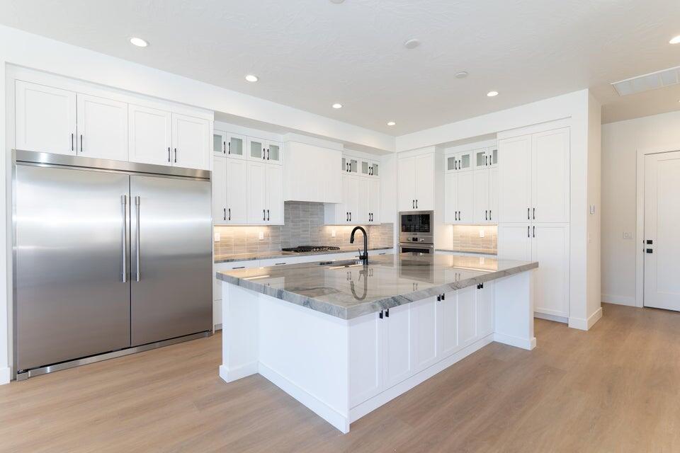 Boasting 8 bedrooms and 8 bathrooms within 4,105 square feet, the Santa Barbara II is perfect for large families or groups seeking an unforgettable stay in Desert Color. The home features a gourmet kitchen, built-in mini bar, and expansive rec rooms designed for fun and relaxation. Bunk rooms accommodate larger groups, making it ideal for family vacations or group getaways. LVP flooring flows throughout the home, with tiled showers in every bathroom adding to the luxury. The second-floor deck, complete with a hot tub and fire table, provides a perfect spot for unwinding. Step into the Desert Color lifestyle with resort-style amenities at your fingertips.