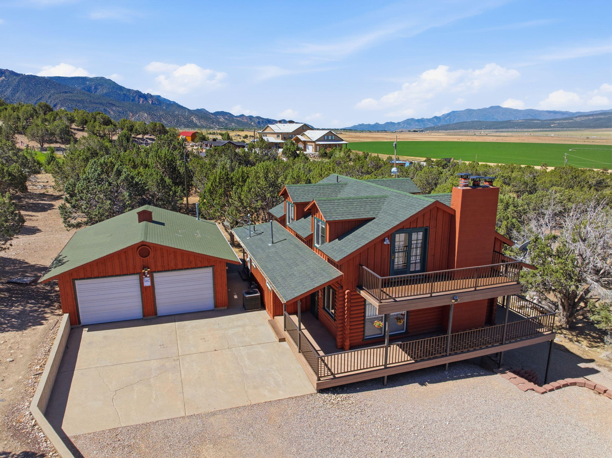 Mountain Cabin Retreat on 4.35 Acres with Incredible Views!

Escape the heat and enjoy mountain living at its finest in this spacious 3-story cabin nestled on 4.35 acres just outside Cedar City. Surrounded by breathtaking views and fresh mountain air, this property offers the perfect blend of privacy, comfort, and versatility.

Designed with room for everyone, the cabin features 3 bedrooms, 3 bathrooms, and 3 cozy fireplaces, creating warm and inviting spaces throughout. Step outside onto the expansive wrap-around deck and take in the stunning scenery from every angle.

The walk-out basement includes a separate entrance, offering endless possibilities for multi-generational living, guest quarters, long-term rental income, or even a short-term rental opportunity. A detached, heated 2-car-deep garage provides ample space for vehicles, toys, and storage.

Recent exterior paint gives the home a fresh look, and the generous parking area easily accommodates guests and recreational vehicles.

Whether you're searching for a full-time residence, a vacation getaway, or an income-producing investment, this mountain retreat offers a rare opportunity to own a piece of Southern Utah paradise.