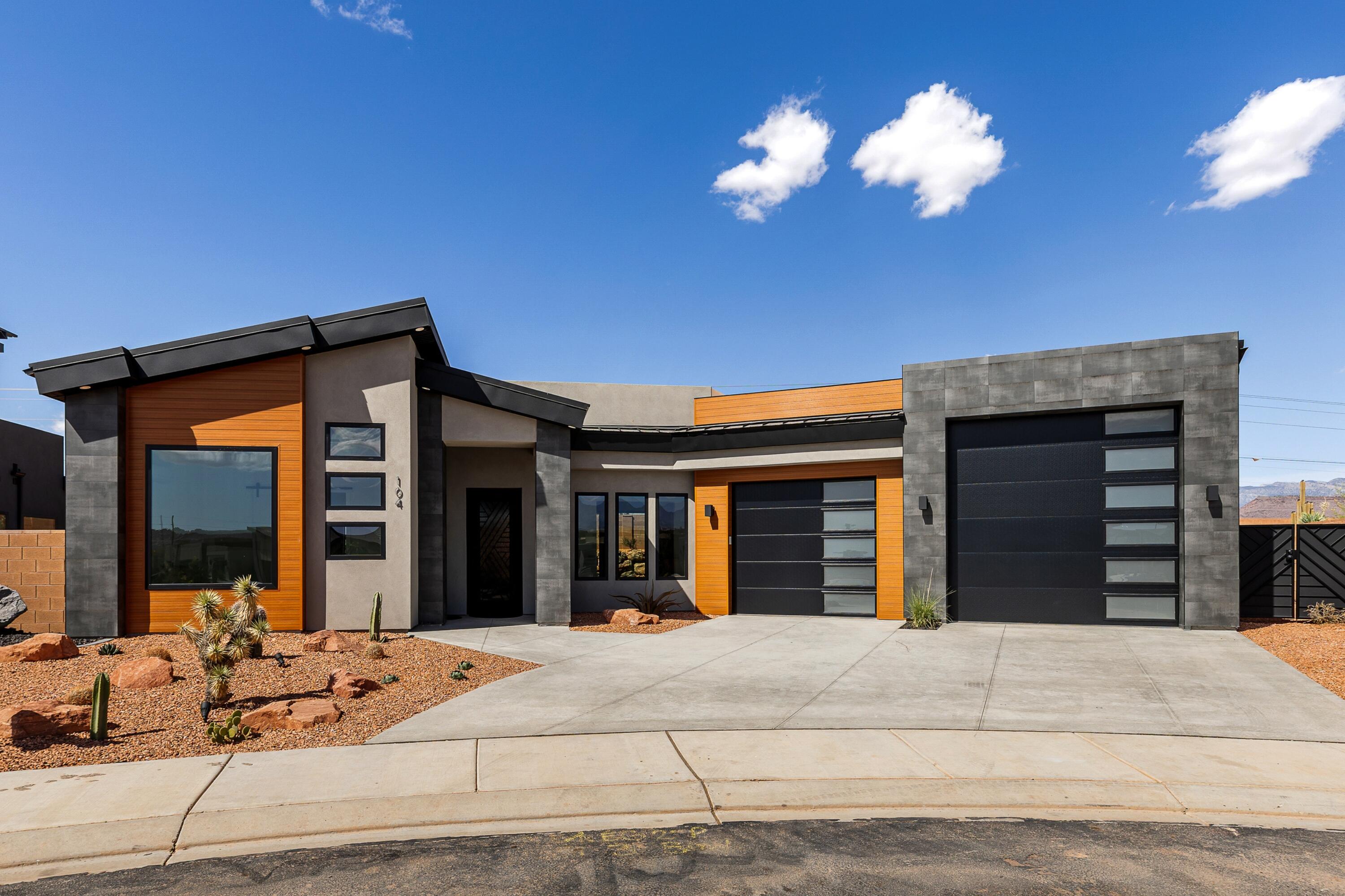 Just completed and move-in ready, this luxury Ivins home showcases premium finishes, rich wood flooring, and a built-in side-by-side refrigerator. The thoughtfully designed floor plan includes 3 bedrooms, a den, and a private front casita for guests or extended family. Each bedroom features its own bathroom and direct outdoor access. Enjoy spectacular Red Mountain views from the rooftop deck, engineered to support a future hot tub. The epoxy-finished garage includes a rare 39' deep bay with room for a boat, trailer, or extra vehicles. No HOA, yet protective CC&Rs help preserve neighborhood quality. An exceptional blend of luxury, privacy, and desert lifestyle in one of Ivins' most desirable locations.