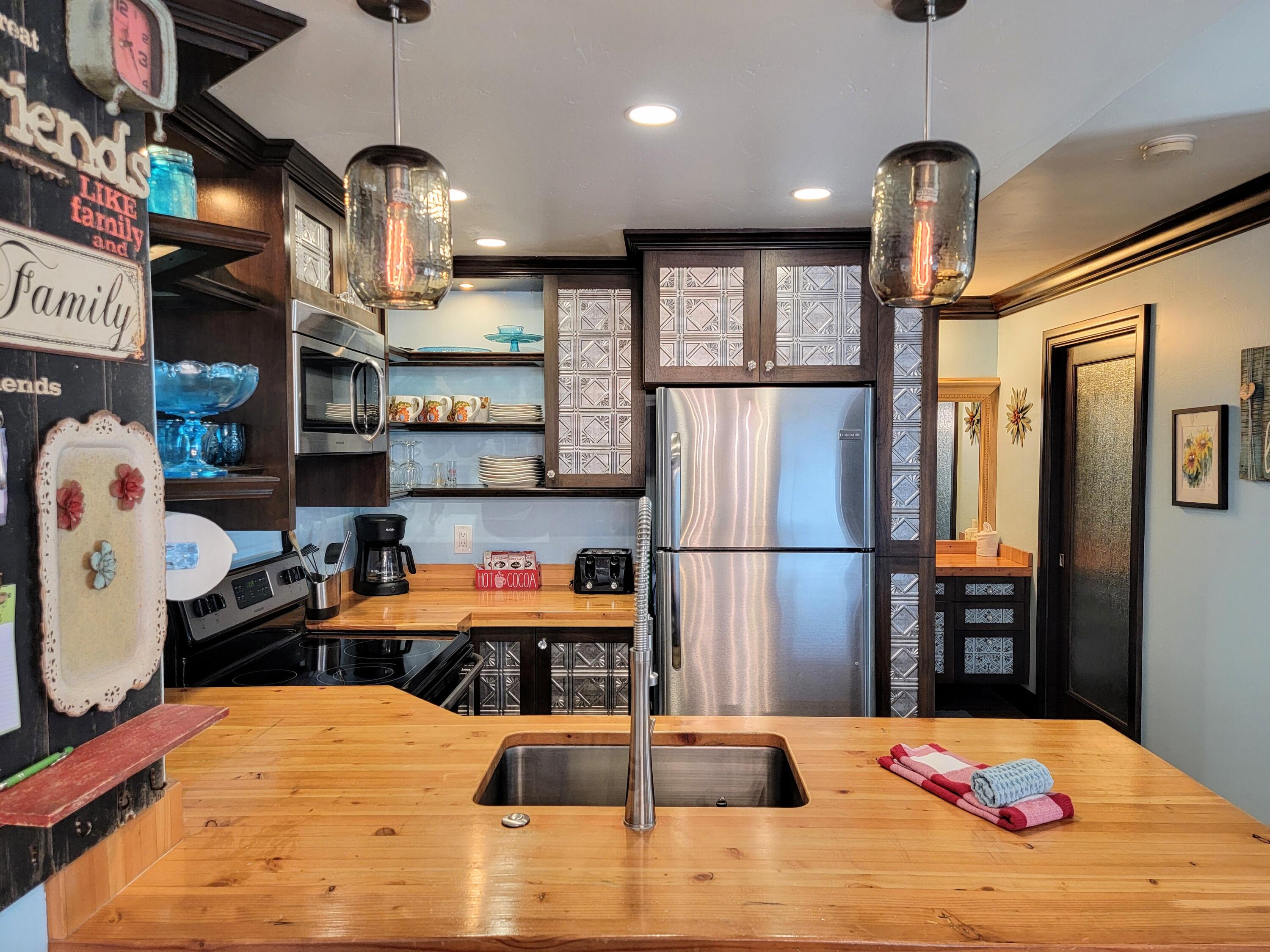 AMAZING LOCATION!! This first floor, pet friendly establishment, is THE perfect spot! You can't get any closer to all the fun!!  Located slope side to the Giant Steps Lodge. Just a moments walk to all the main amenities. Summer and winter activities, Festivals, live music, ski slopes, restaurants, general store, mntn. biking, tube hill, archery, BH pond and park with fishing, horse shoes, volleyball, kids play areas, & the list goes on... 
Really a prime location to all the National parks and BLM for all your ATV/ SxS & Snowmobile riding.
The HOA offers great amenities: Clubhouse area with relaxing hot tub & sauna, laundry, storage lockers, outside recreational areas & more. 
The unit is sold furnished and turn key ready, STR approved, or your own private mountain getaway.
 WELCOME HOME !!